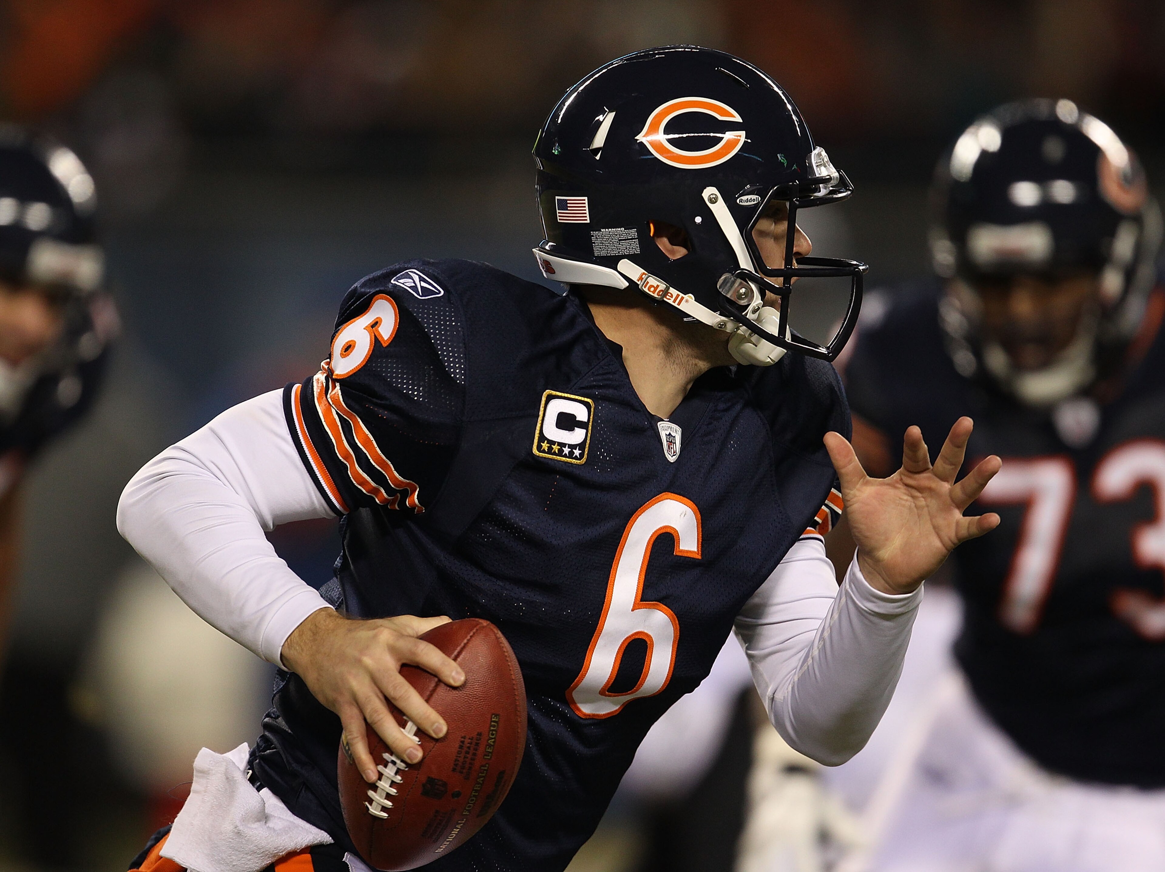 CHICAGO - NOVEMBER 28: Jay Cutler #6 of the Chicago Bears rolls out to look for a receiver against  the Philadelphia Eagles at Soldier Field on November 28, 2010 in Chicago, Illinois. The Bears defeated the Eagles 31-26. (Photo by Jonathan Daniel/Getty Im