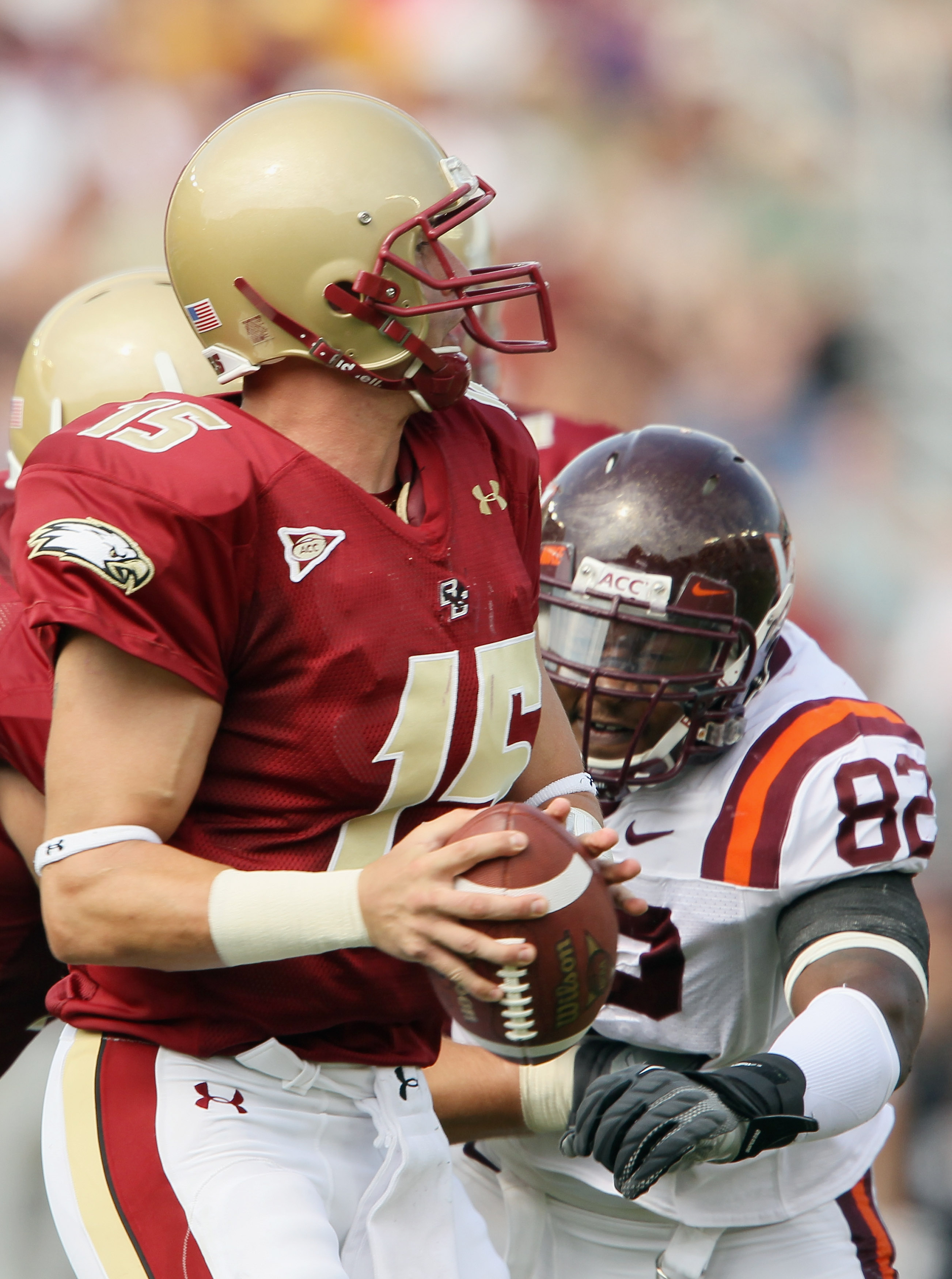 CHESTNUT HILL, MA - SEPTEMBER 25: Dave Shinskie #15 of the Boston College Eagles is pressured by Steven Friday #82 of the Virginia Tech Hokies on September 25, 2010 at Alumni Stadium in Chestnut Hill, Massachusetts. (Photo by Elsa/Getty Images)
