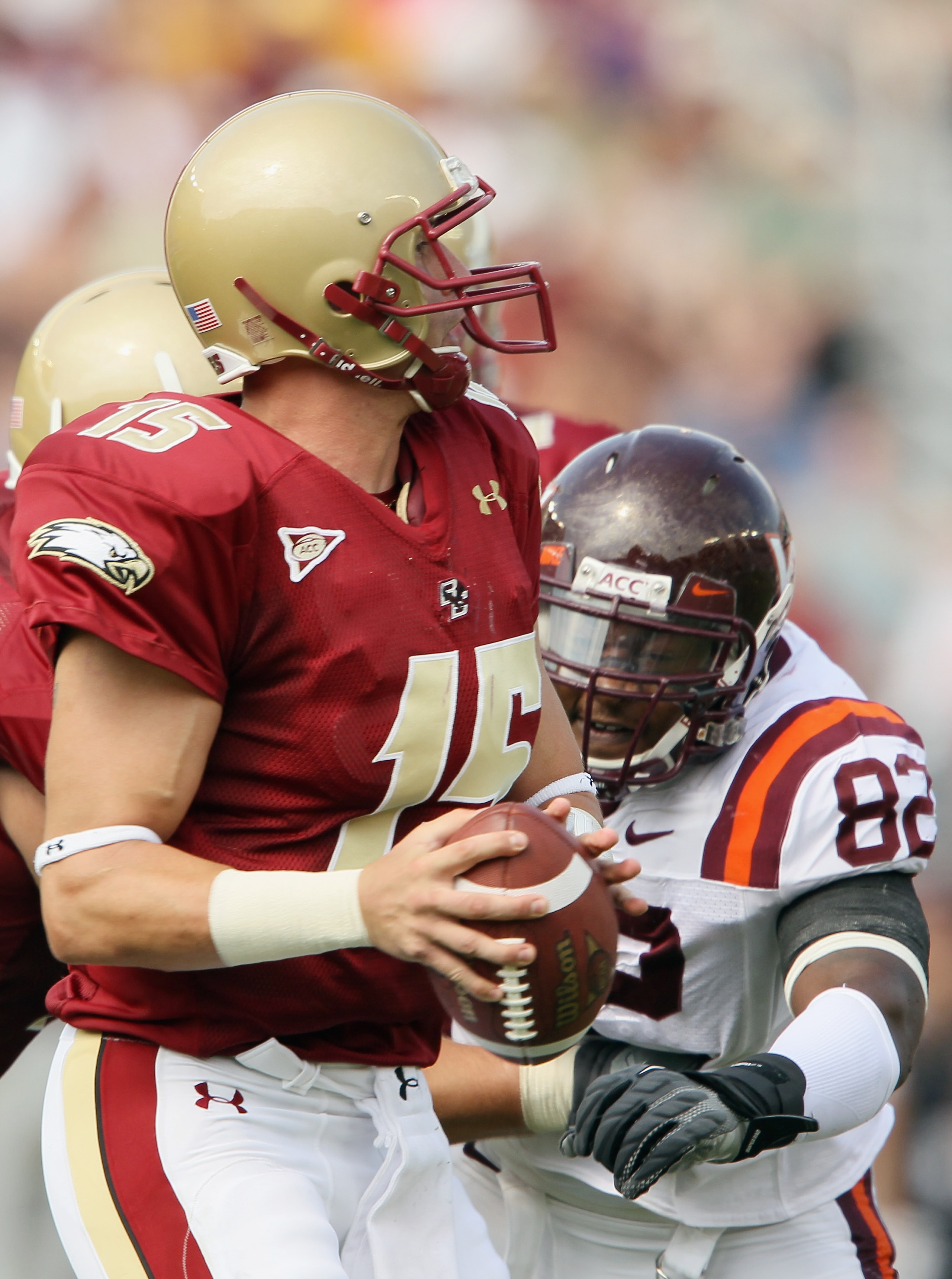 CHESTNUT HILL, MA - SEPTEMBER 25: Dave Shinskie #15  of the Boston College Eagles is pressured by Steven Friday #82 of the Virginia Tech Hokies on September 25, 2010 at Alumni Stadium in Chestnut Hill, Massachusetts.  (Photo by Elsa/Getty Images)