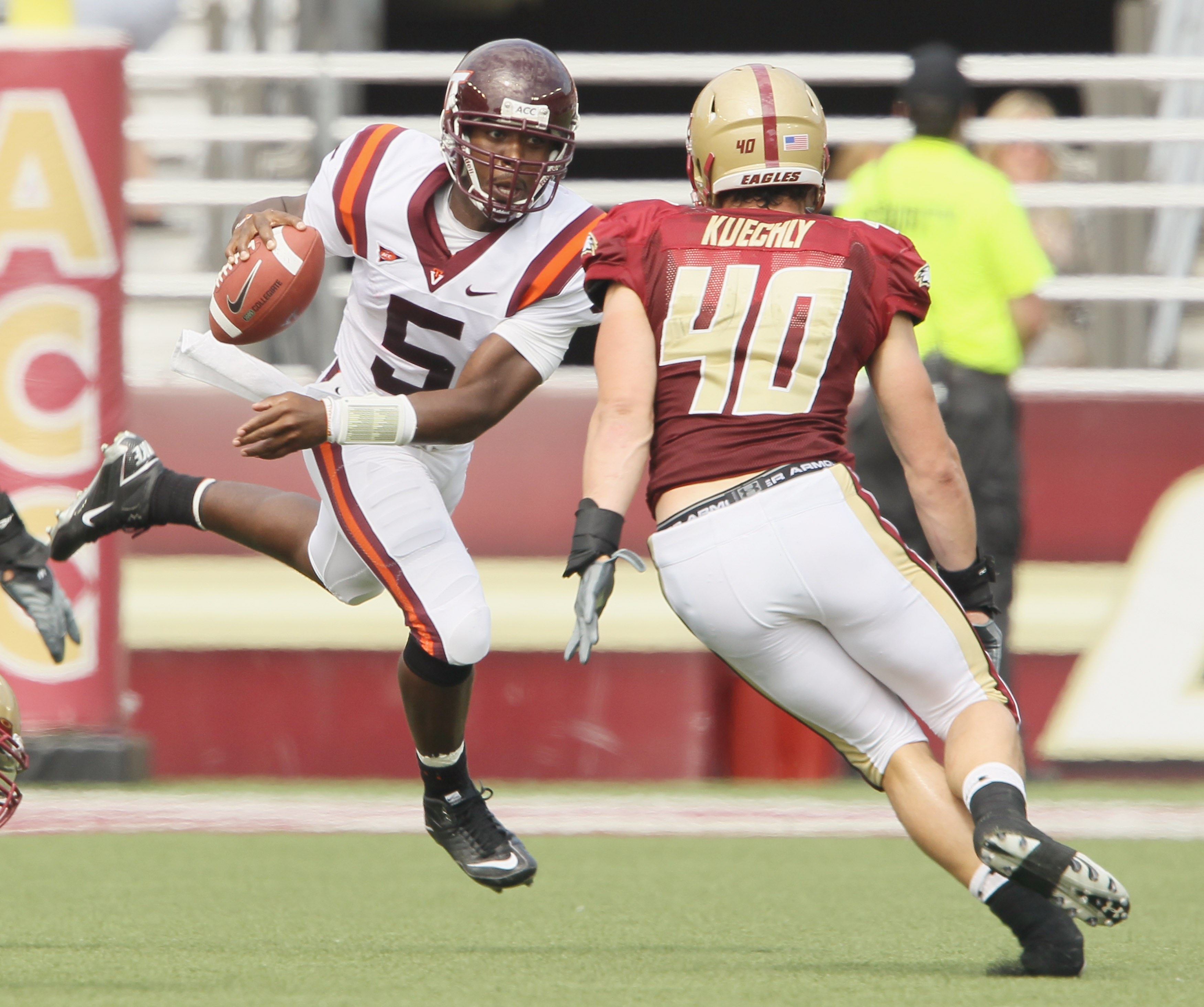CHESTNUT HILL, MA - SEPTEMBER 25: Tyrod Taylor #5 of the Virginia Tech Hokies scrambles with the ball as Luke Kuechly #40 of the Boston College Eagles defends on September 25, 2010 at Alumni Stadium in Chestnut Hill, Massachusetts. (Photo by Elsa/Getty