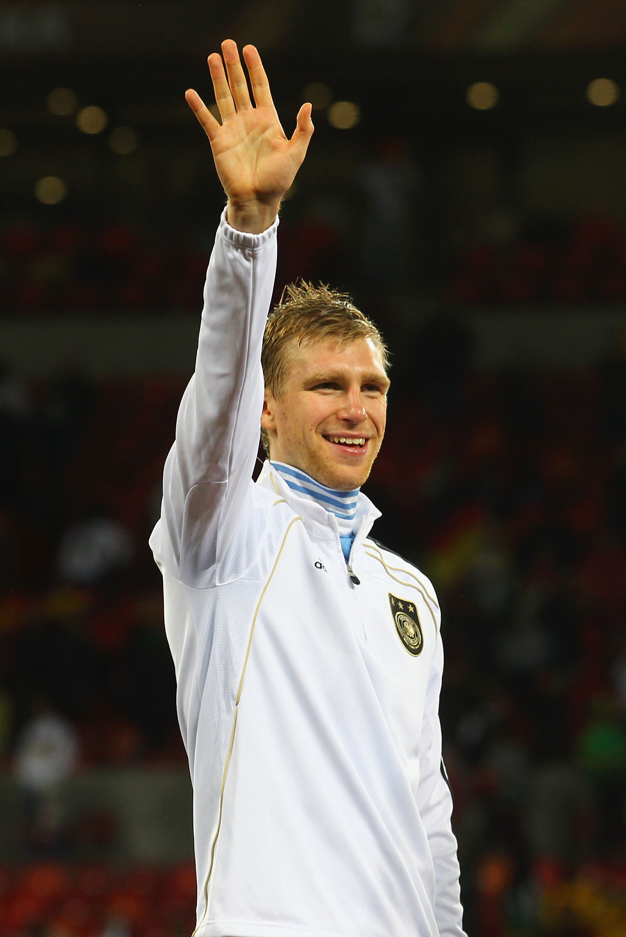 PORT ELIZABETH, SOUTH AFRICA - JULY 10:  Per Mertesacker of Germany celebrates victory and third place following the 2010 FIFA World Cup South Africa Third Place Play-off match between Uruguay and Germany at The Nelson Mandela Bay Stadium on July 10, 2010