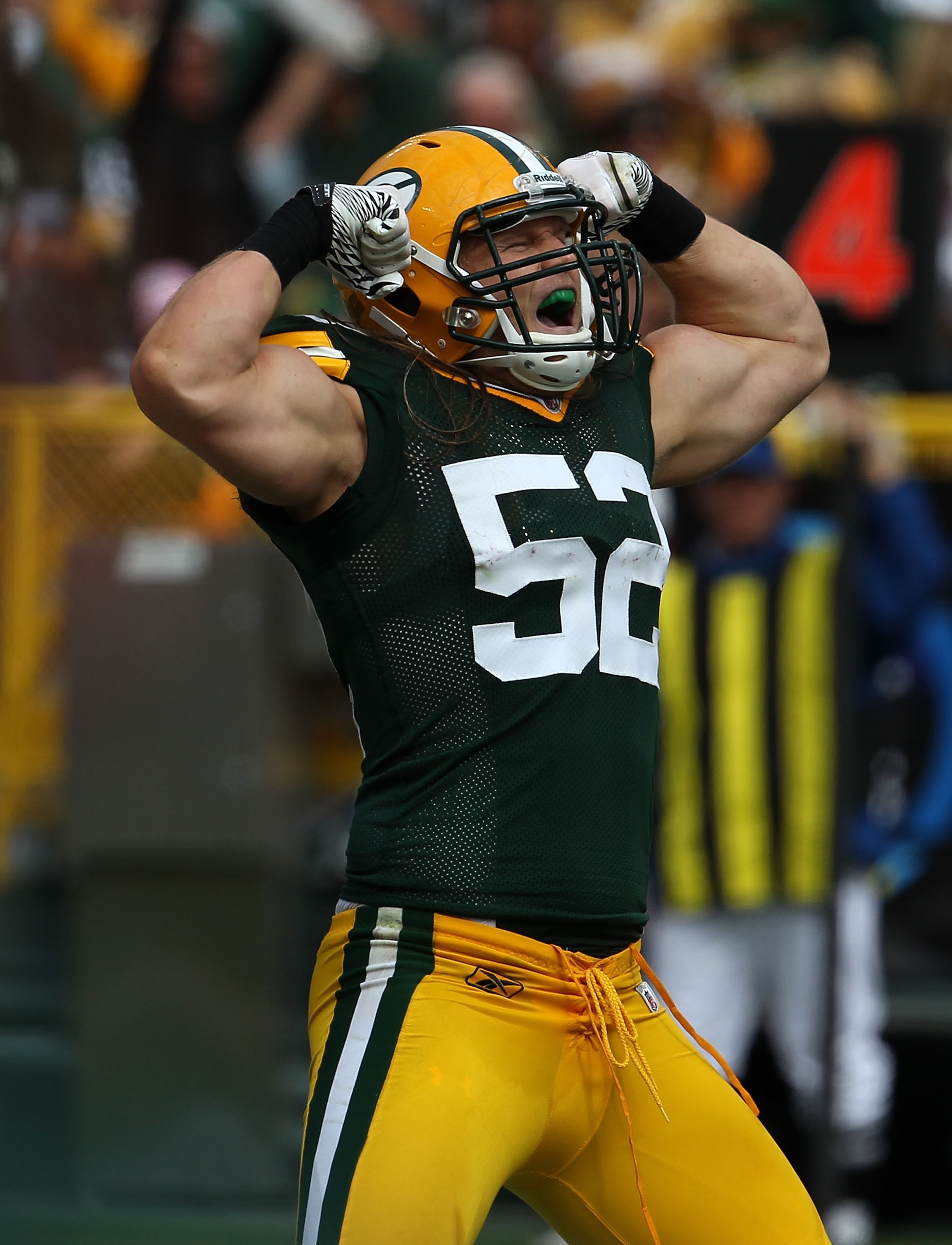 GREEN BAY, WI - SEPTEMBER 19: Clay Matthews #52 of the Green Bay Packers celebrates a defensive stop against the Buffalo Bills at Lambeau Field on September 19, 2010 in Green Bay, Wisconsin. The Packers defeated the Bills 34-7. (Photo by Jonathan Daniel/G
