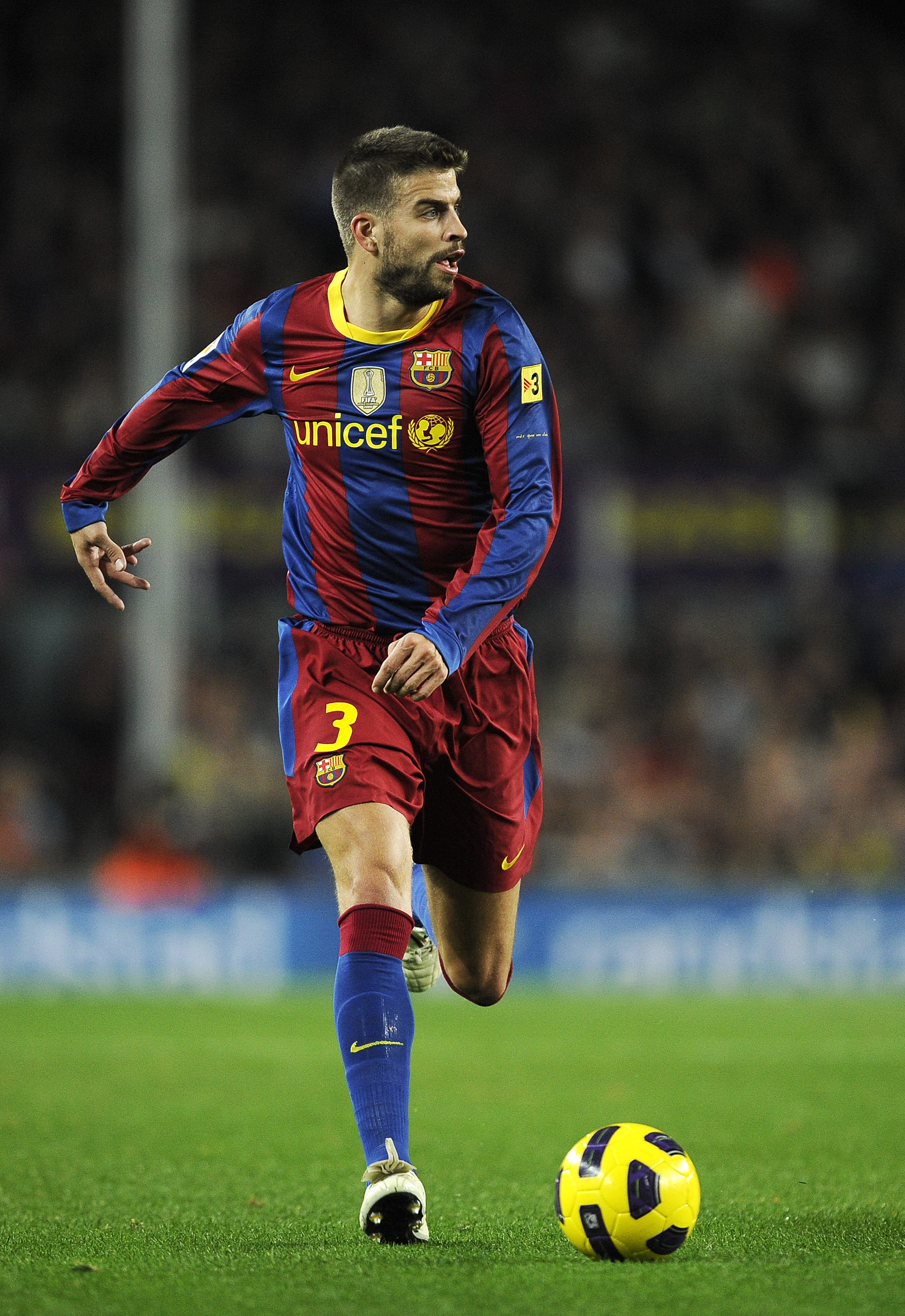 BARCELONA, SPAIN - OCTOBER 30:  Gerard Pique of Barcelona runs with the ball during the La Liga match between Barcelona and Sevilla FC on October 30, 2010 in Barcelona, Spain. Barcelona won the match 5-0.  (Photo by David Ramos/Getty Images)