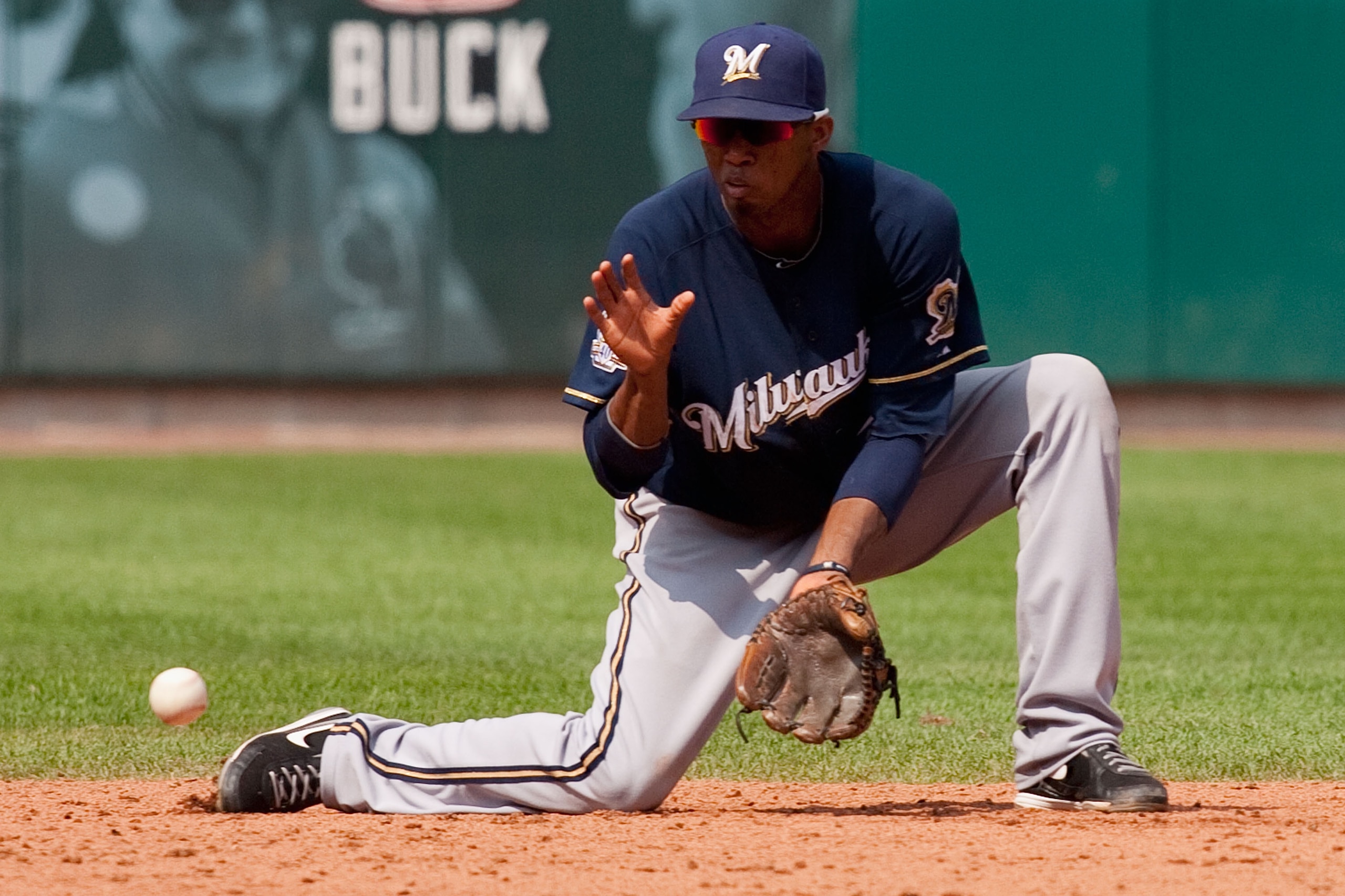 ST. LOUIS - AUGUST 18: Alcides Escobar #21 of the Milwaukee Brewers fields a ground ball against the St. Louis Cardinals at Busch Stadium on August 18, 2010 in St. Louis, Missouri.  The Brewers beat the Cardinals 3-2.  (Photo by Dilip Vishwanat/Getty Imag