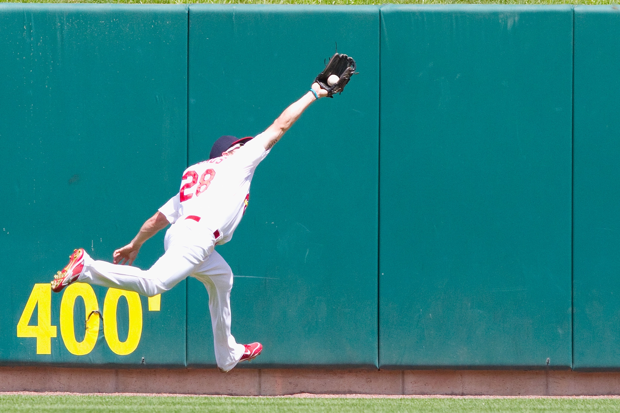 ST. LOUIS - AUGUST 15: Colby Rasmus #28 of the St. Louis Cardinals catches a deep fly ball against the Chicago Cubs at Busch Stadium on August 15, 2010 in St. Louis, Missouri.  The Cubs beat the Cardinals 9-7.  (Photo by Dilip Vishwanat/Getty Images)
