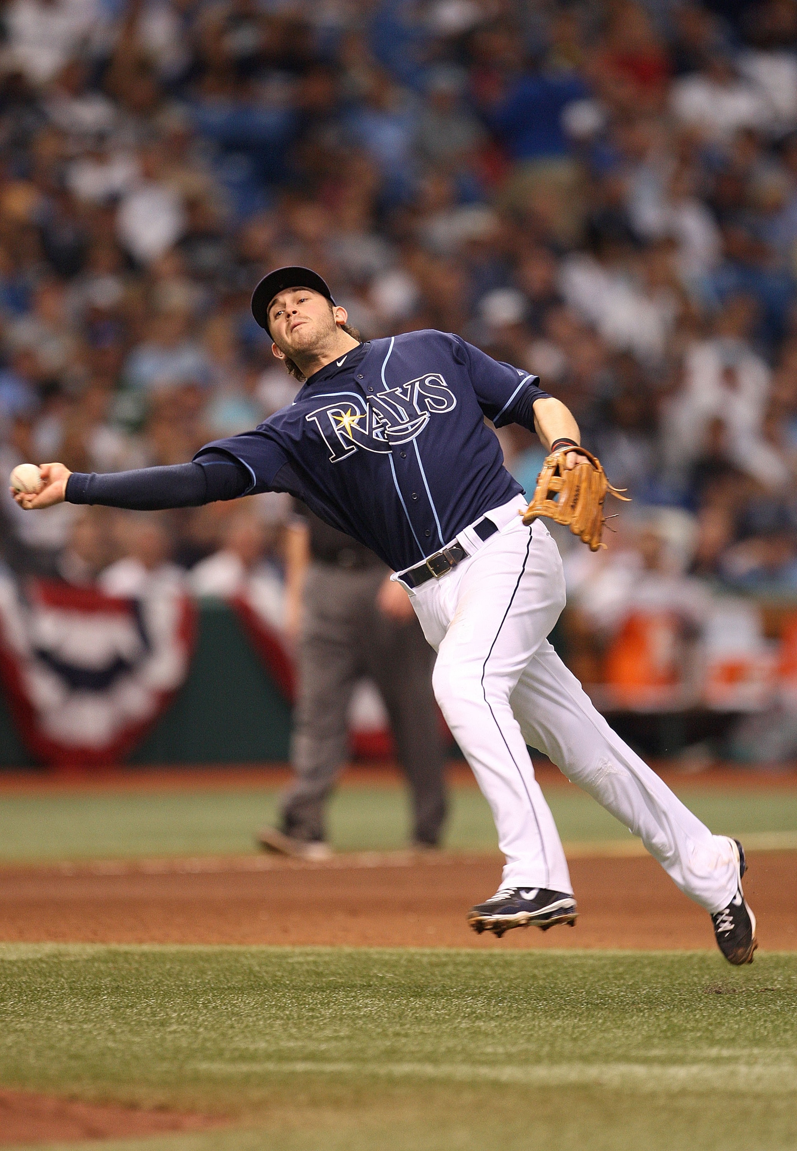 ST PETERSBURG, FL - OCTOBER 07: Evan Longoria #3 of the Tampa Bay Rays makes a throw to first during Game 2 of the ALDS against the Texas Rangers at Tropicana Field on October 7, 2010 in St. Petersburg, Florida.  (Photo by Mike Ehrmann/Getty Images)