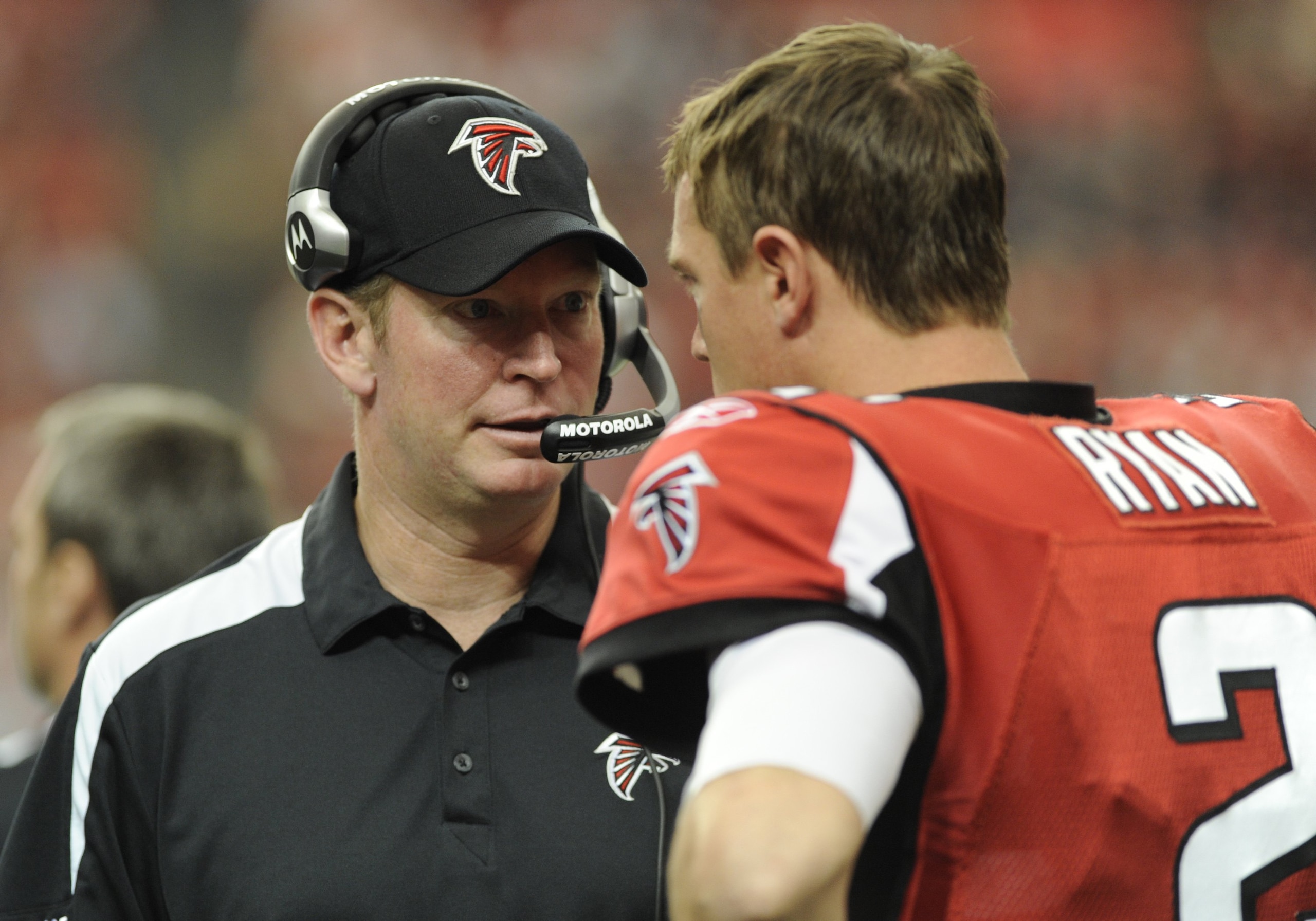 ATLANTA - NOVEMBER 9: Quarterback Matt Ryan #2 of the Atlanta Falcons talks with quarterbacks coach Bill Musgrave during play against the New Orleans Saints at the Georgia Dome on November 9, 2008 in Atlanta, Georgia.  (Photo by Al Messerschmidt/Getty Ima