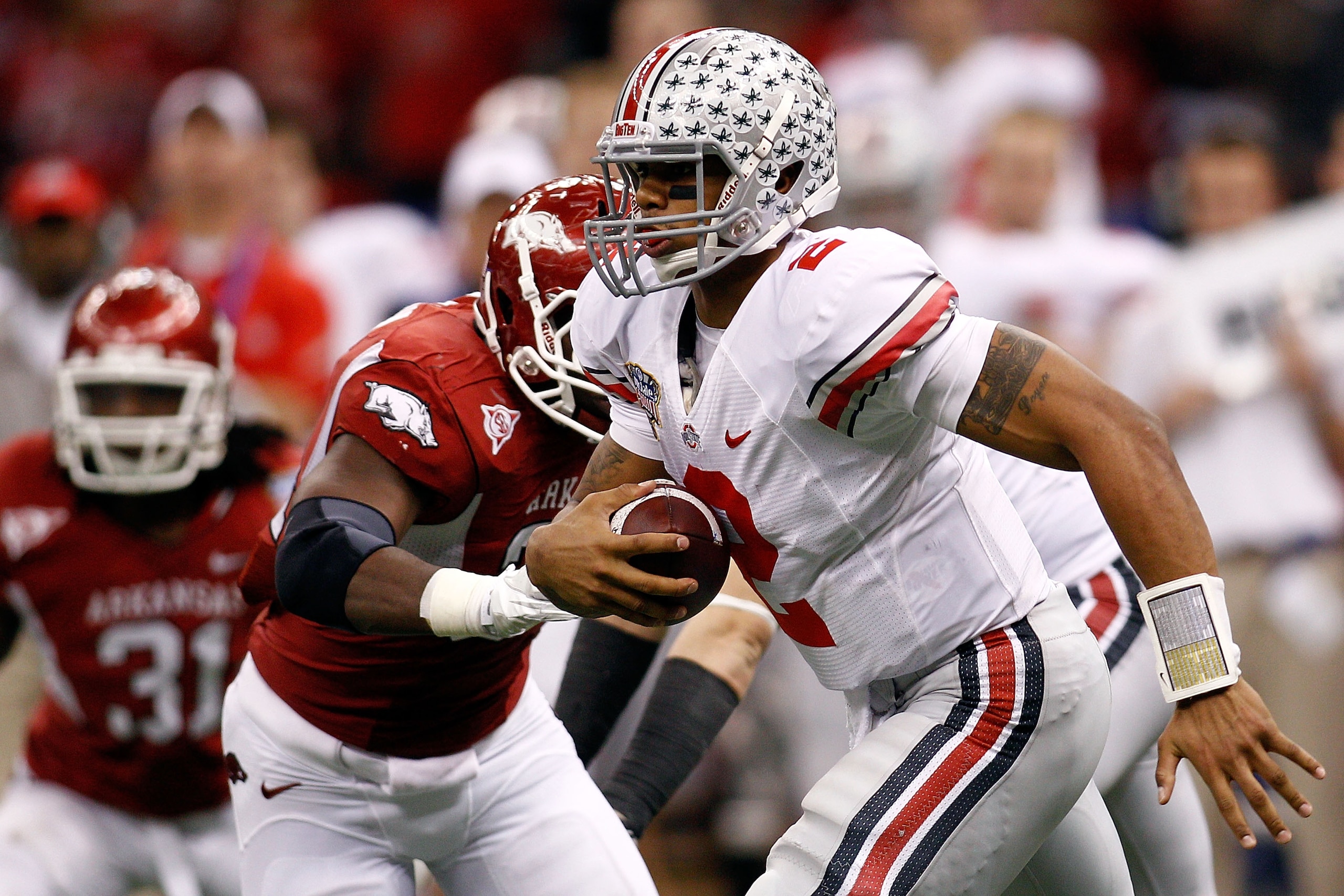 NEW ORLEANS, LA - JANUARY 04:  Quarterback Terrelle Pryor #2 of the Ohio State Buckeyes looks to run against the Arkansas Razorbacks during the Allstate Sugar Bowl at the Louisiana Superdome on January 4, 2011 in New Orleans, Louisiana.  (Photo by Chris G