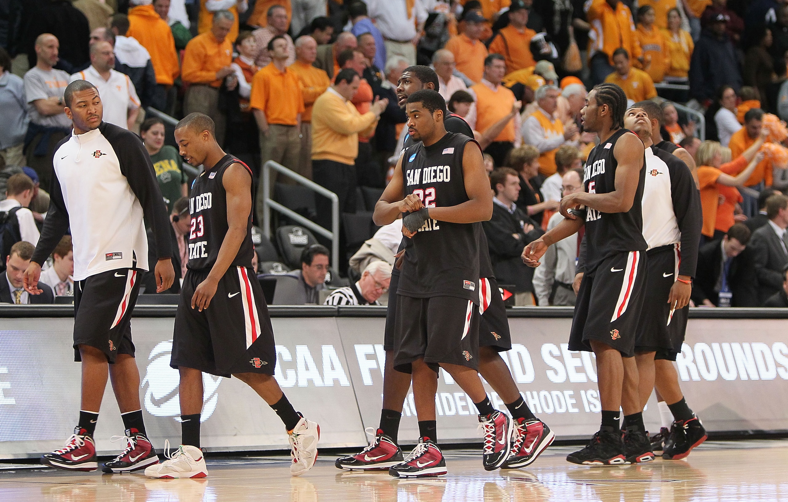 PROVIDENCE, RI - MARCH 19:  Members of the San Diego State Aztecs leave the court after a 62-59 loss to the Tennessee Volunteers during the first round of the 2010 NCAA men's basketball tournament at Dunkin' Donuts Center on March 19, 2010 in Providence,