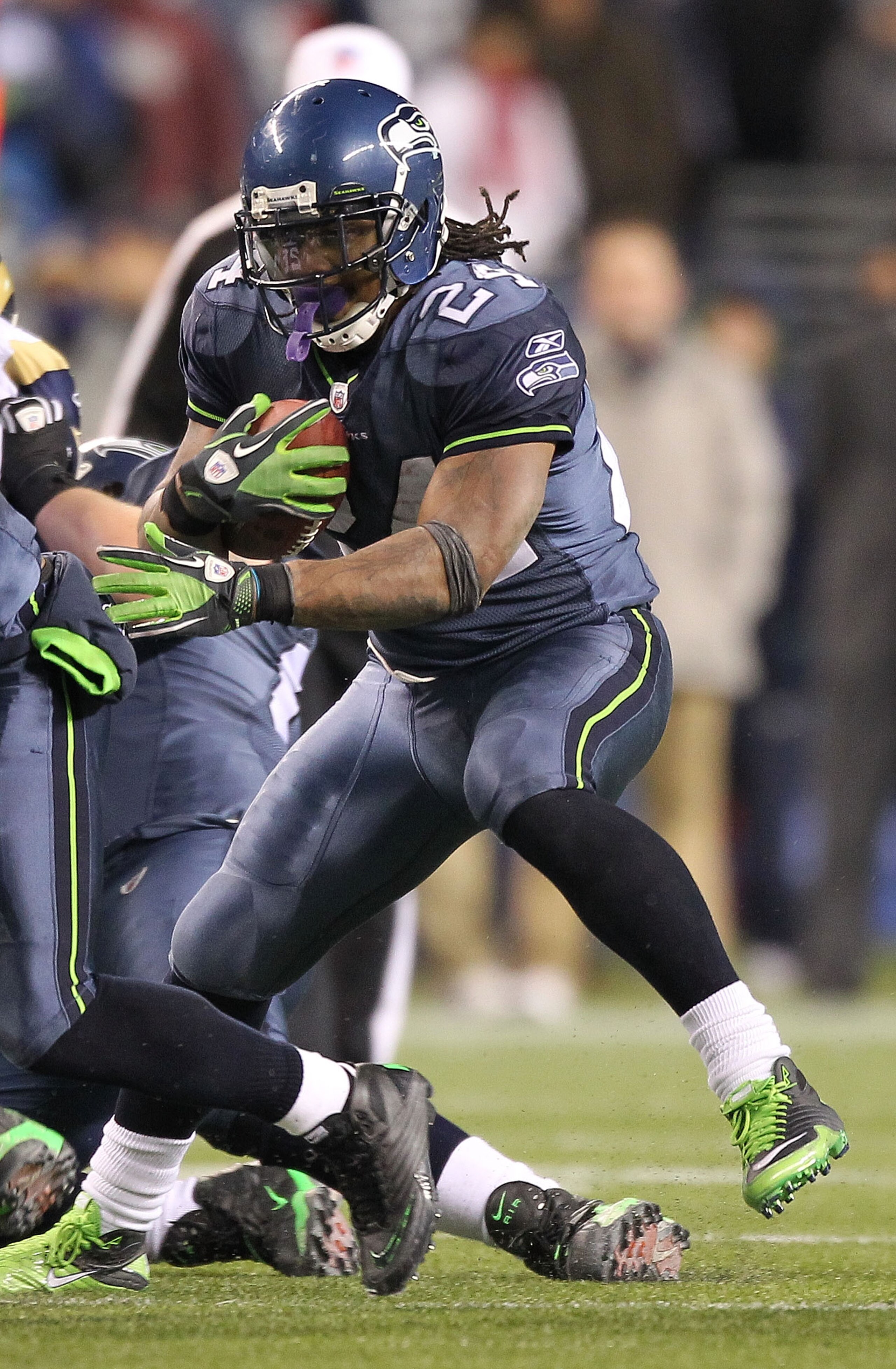 SEATTLE, WA - JANUARY 02:  Running back Marshawn Lynch #24 of the Seattle Seahawks rushes with the ball against the St. Louis Rams during their game at Qwest Field on January 2, 2011 in Seattle, Washington.  (Photo by Otto Greule Jr/Getty Images)