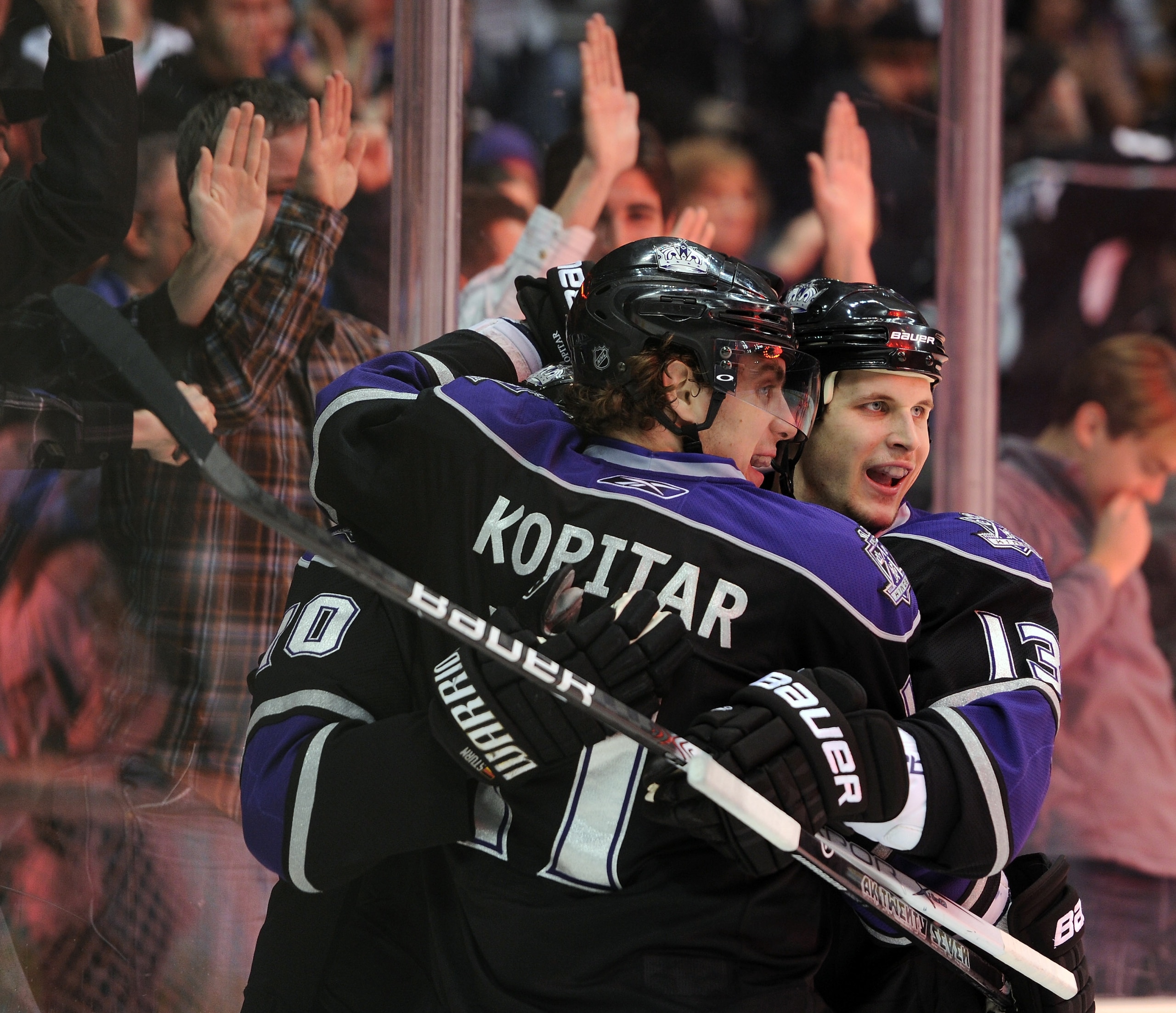 LOS ANGELES, CA - JANUARY 06:  Kyle Clifford #13 of the Los Angeles Kings celebrates his goal with Anze Kopitar #11 for a 1-0 lead over the Nashville Predators during the second period at the Staples Center on January 6, 2011 in Los Angeles, California.