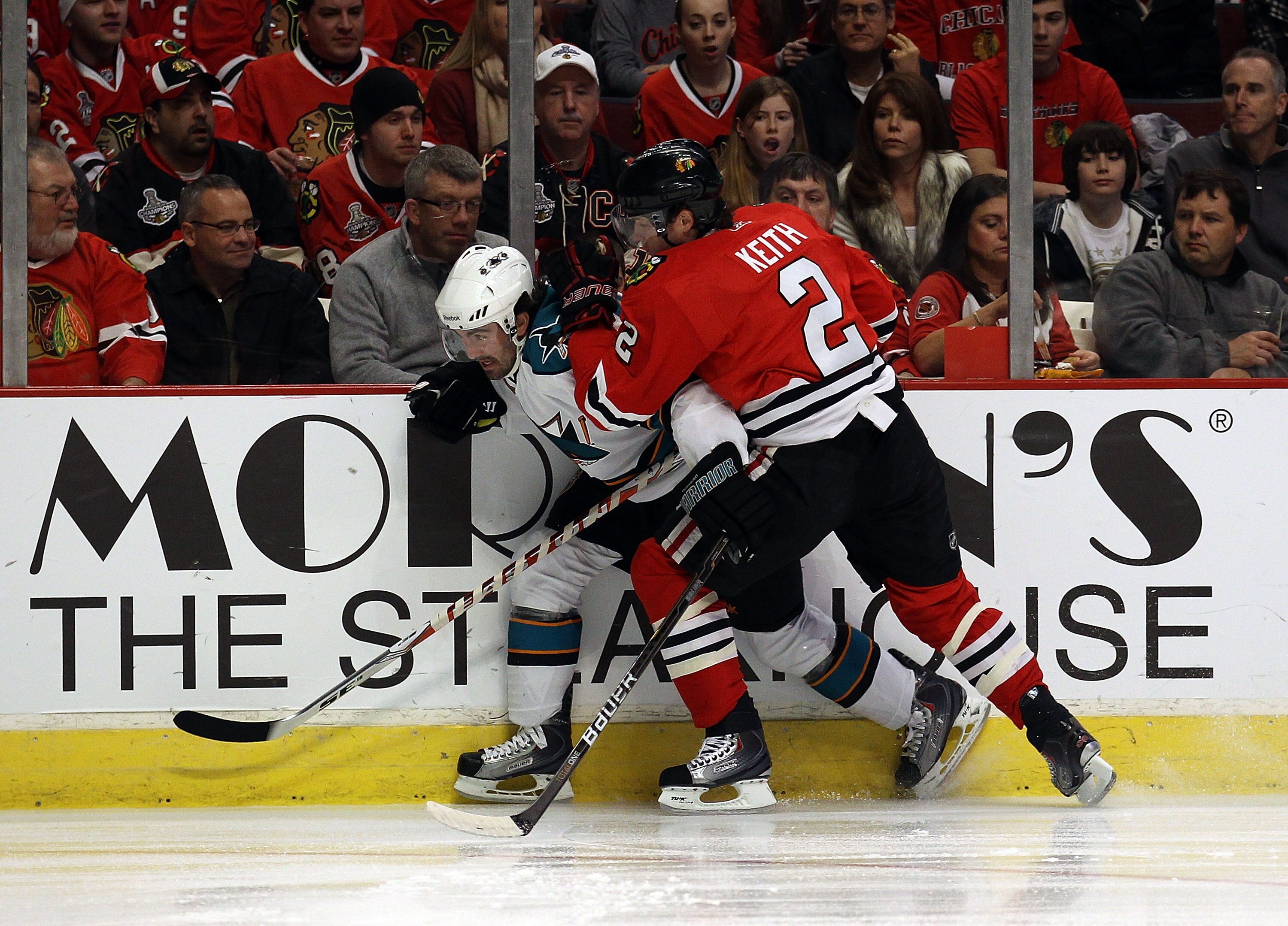 CHICAGO, IL - DECEMBER 30: Duncan Keith #2 of the Chicago Blackhawks checks Benn Ferriero #78 of the San Jose Sharks at the United Center on December 30, 2010 in Chicago, Illinois. The Sharks defeated the Blackhawks 5-3. (Photo by Jonathan Daniel/Getty Im