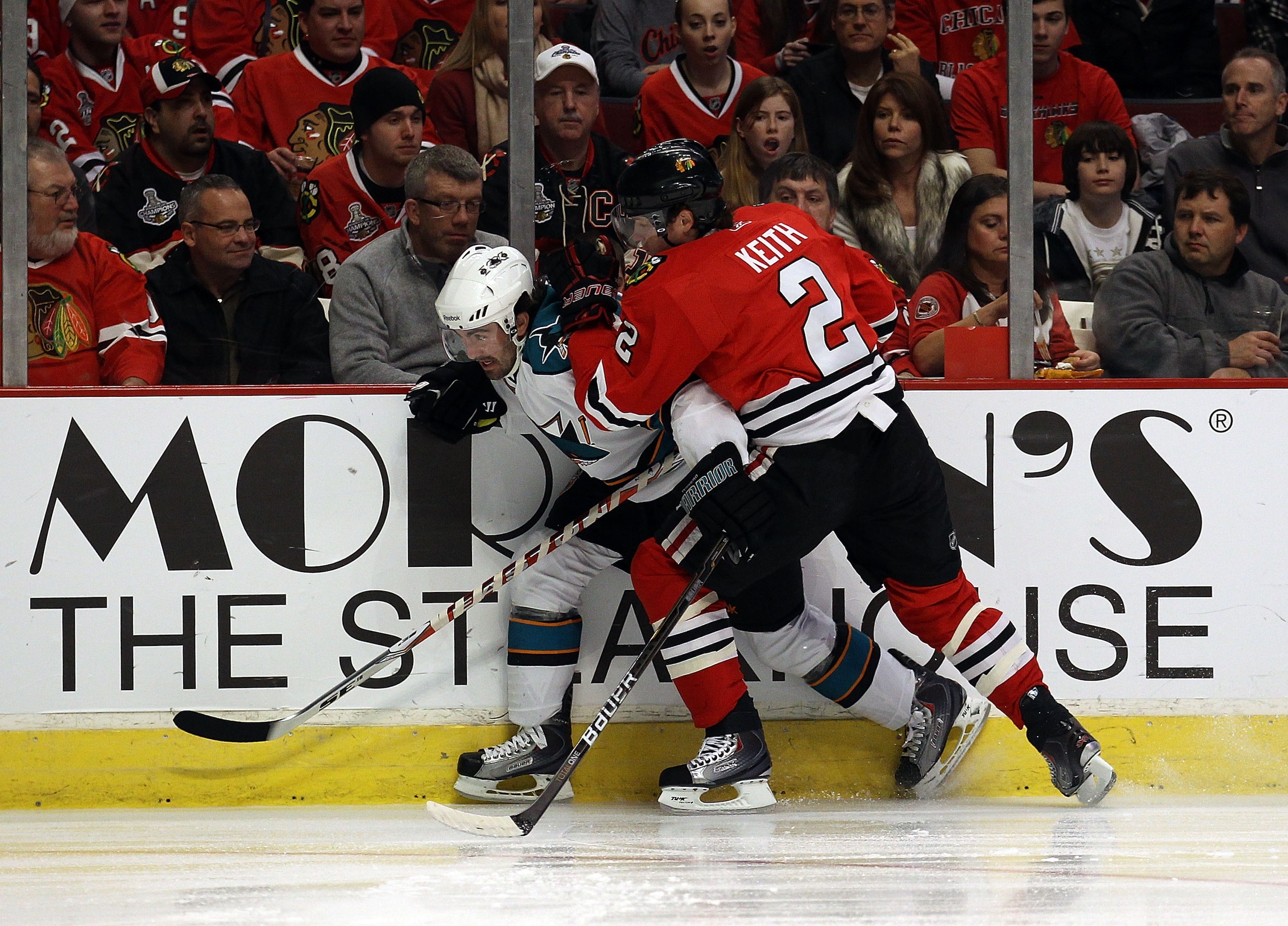 CHICAGO, IL - DECEMBER 30: Duncan Keith #2 of the Chicago Blackhawks checks Benn Ferriero #78 of the San Jose Sharks at the United Center on December 30, 2010 in Chicago, Illinois. The Sharks defeated the Blackhawks 5-3. (Photo by Jonathan Daniel/Getty Im