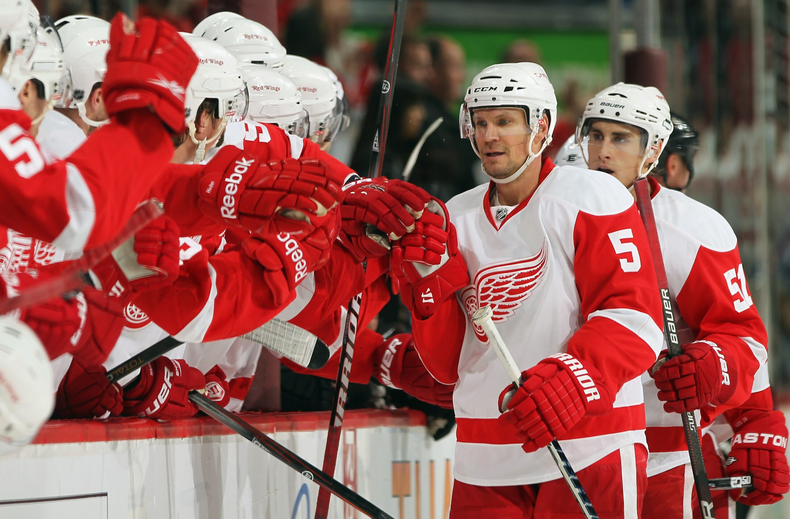 DENVER - DECEMBER 27:  Nicklas Lidstrom #5 of the Detroit Red Wings celebrates his third period goal with his bench against the Colorado Avalanche looks on at the Pepsi Center on December 27, 2010 in Denver, Colorado. The Red Wings defeated the Avalanche
