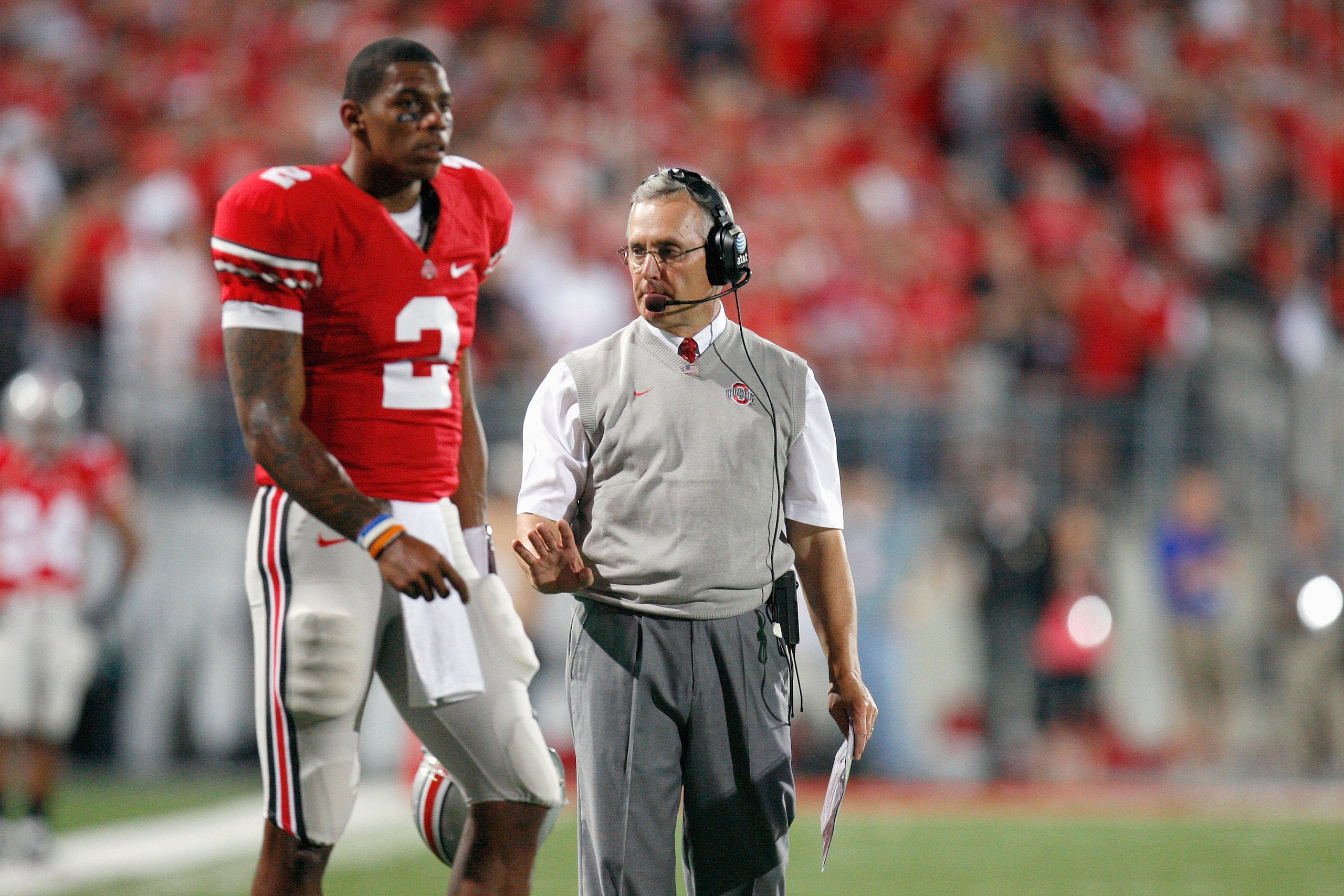 COLUMBUS, OH - SEPTEMBER 12: Quarterback Terrelle Pryor #2 of the Ohio State Buckeyes and head coach Jim Tressel walk on the field during the game against the Southern California Trojans on September 12, 2009 at Ohio Stadium in Columbus, Ohio. The Trojans