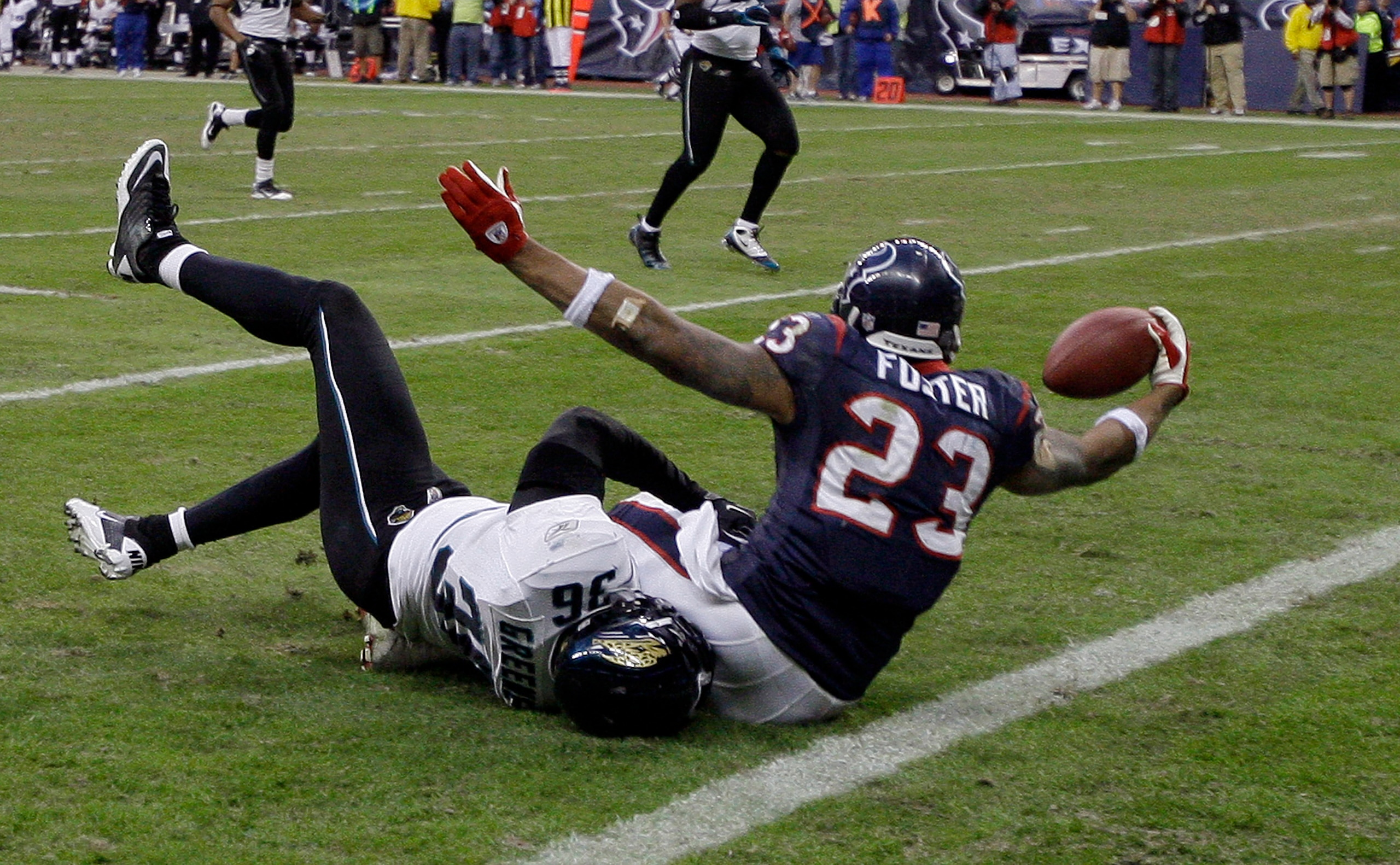 HOUSTON - JANUARY 02: Running back Arian Foster #23 of the Houston Texans scores as he is tackled by Courtney Greene #36 of the Jacksonville Jaguars at Reliant Stadium on January 2, 2011 in Houston, Texas. (Photo by Bob Levey/Getty Images) HOUSTON - JANUARY 02: Running back Arian Foster #23 of the Houston Texans scores as he is tackled by Courtney Greene #36 of the Jacksonville Jaguars at Reliant Stadium on January 2, 2011 in Houston, Texas. (Photo by Bob Levey/Getty Images)