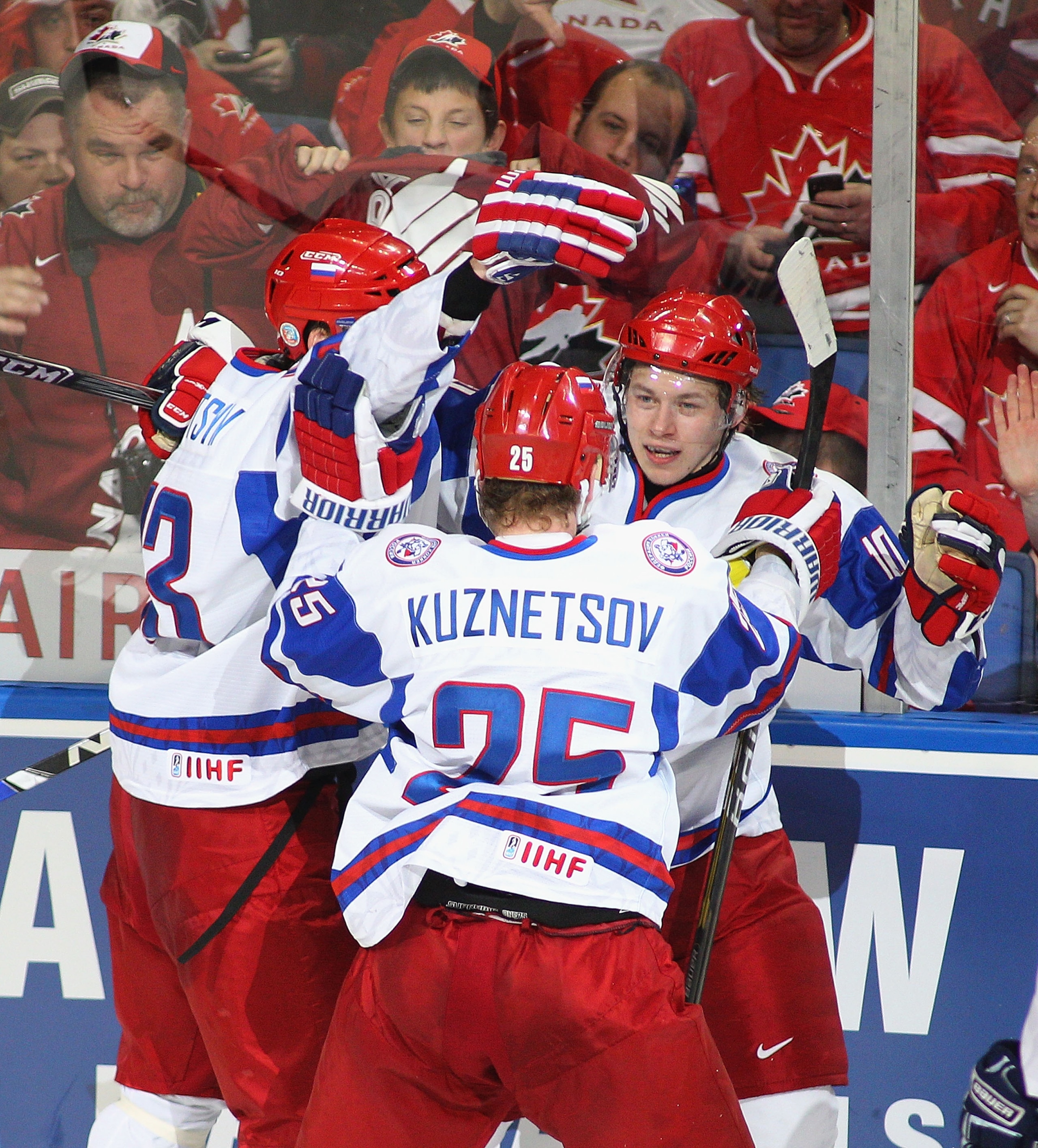 BUFFALO, NY - JANUARY 05: Maxim Kitsyn #13, Yevgeni Kuznetsov #25 and Vladimir Tarasenko #10  of Russia celebrate Tarasenko's goal to tie the game at 3-3 with Canada during the 2011 IIHF World U20 Championship Gold medal game between Canada and Russia on