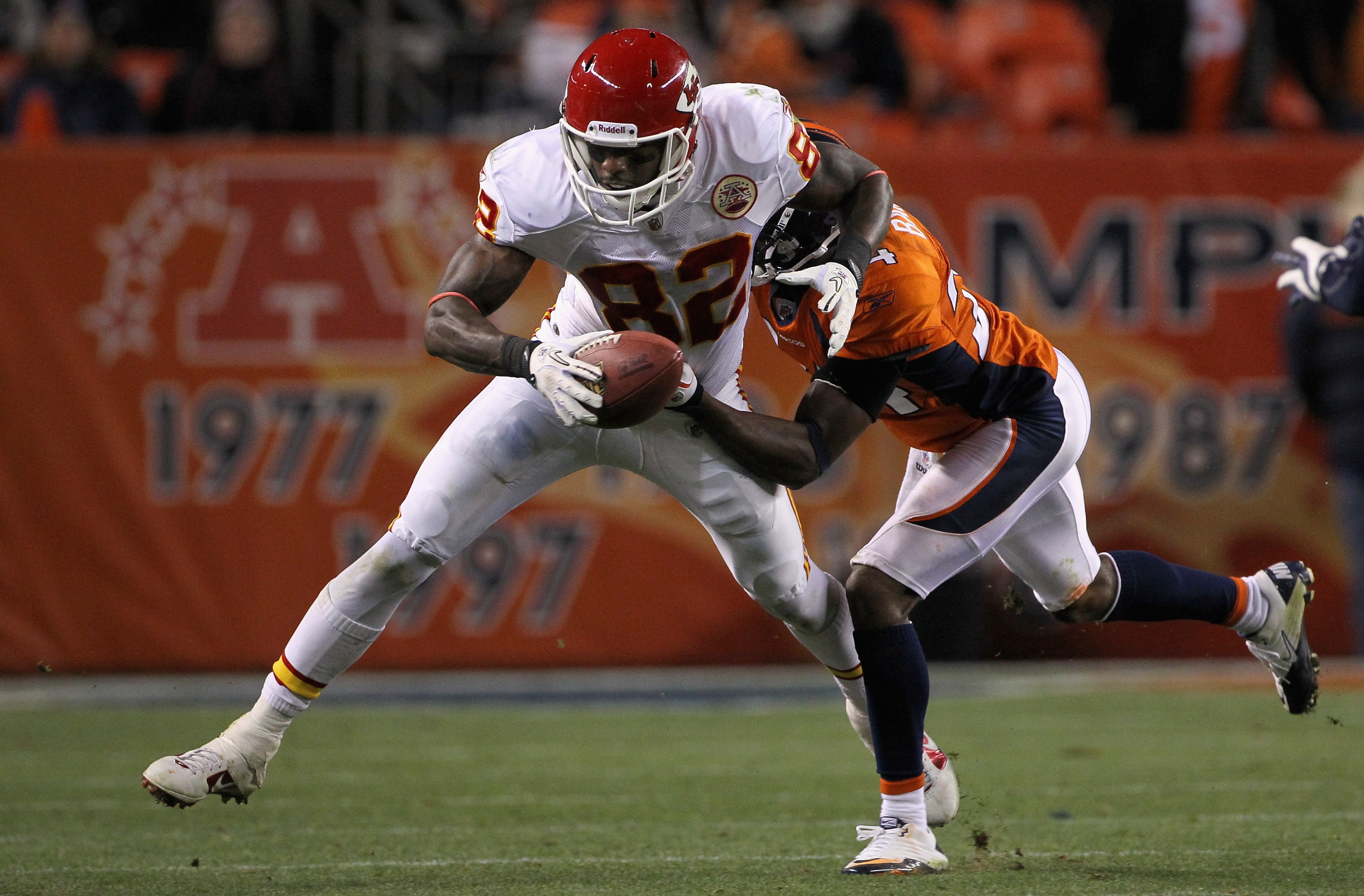 DENVER - NOVEMBER 14:  Wide receiver Dwayne Bowe #82 of the Kansas City Chiefs makes a reception as Champ Bailey #24 of the Denver Bronco defends at INVESCO Field at Mile High on November 14, 2010 in Denver, Colorado. The Broncos defeated the Cheifs 49-29
