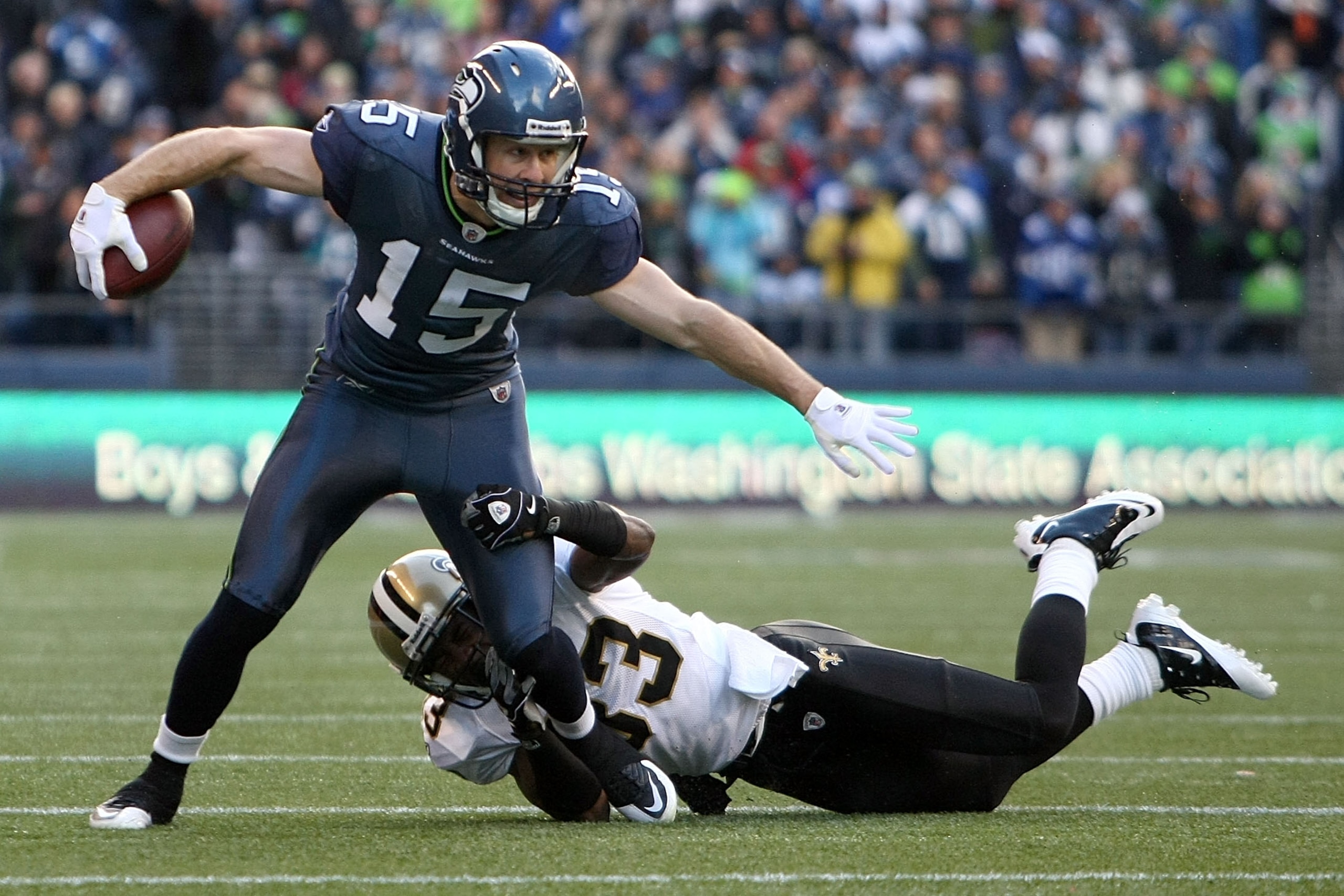 SEATTLE, WA - JANUARY 08: Brandon Stokley #15 of the Seattle Seahawks attempts to avoid a tackle from Jabari Greer #33 of the New Orleans Saints as he runs for five-yards after the catch in the first quarter during the 2011 NFC wild-card playoff game at SEATTLE, WA - JANUARY 08: Brandon Stokley #15 of the Seattle Seahawks attempts to avoid a tackle from Jabari Greer #33 of the New Orleans Saints as he runs for five-yards after the catch in the first quarter during the 2011 NFC wild-card playoff game at