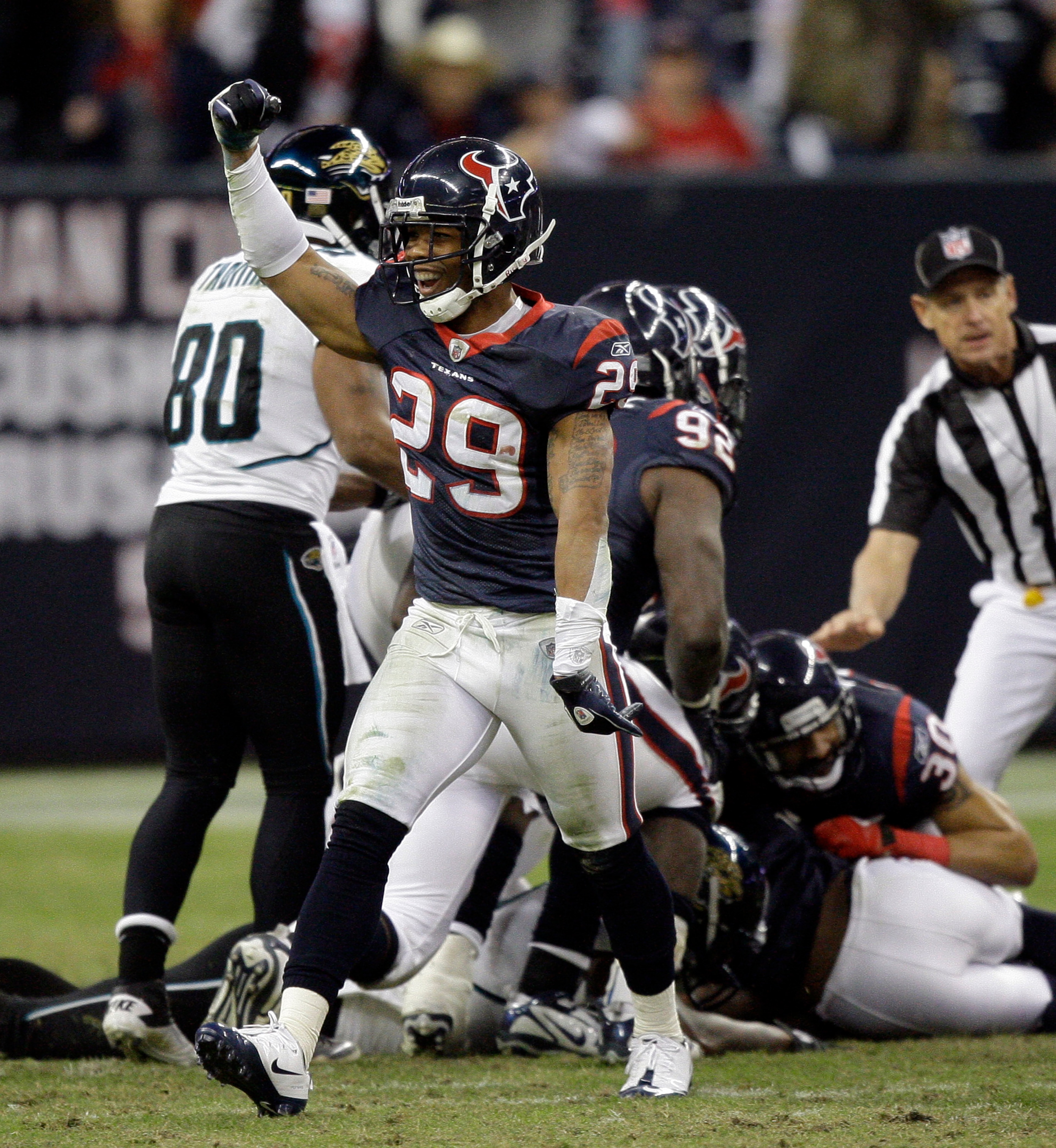 HOUSTON - JANUARY 02:  Glover Quin #29 of the Houston Texans celebrates after recovering a fumble late in the fourth quarter against the Jacksonville Jaguars at Reliant Stadium on January 2, 2011 in Houston, Texas.  (Photo by Bob Levey/Getty Images)