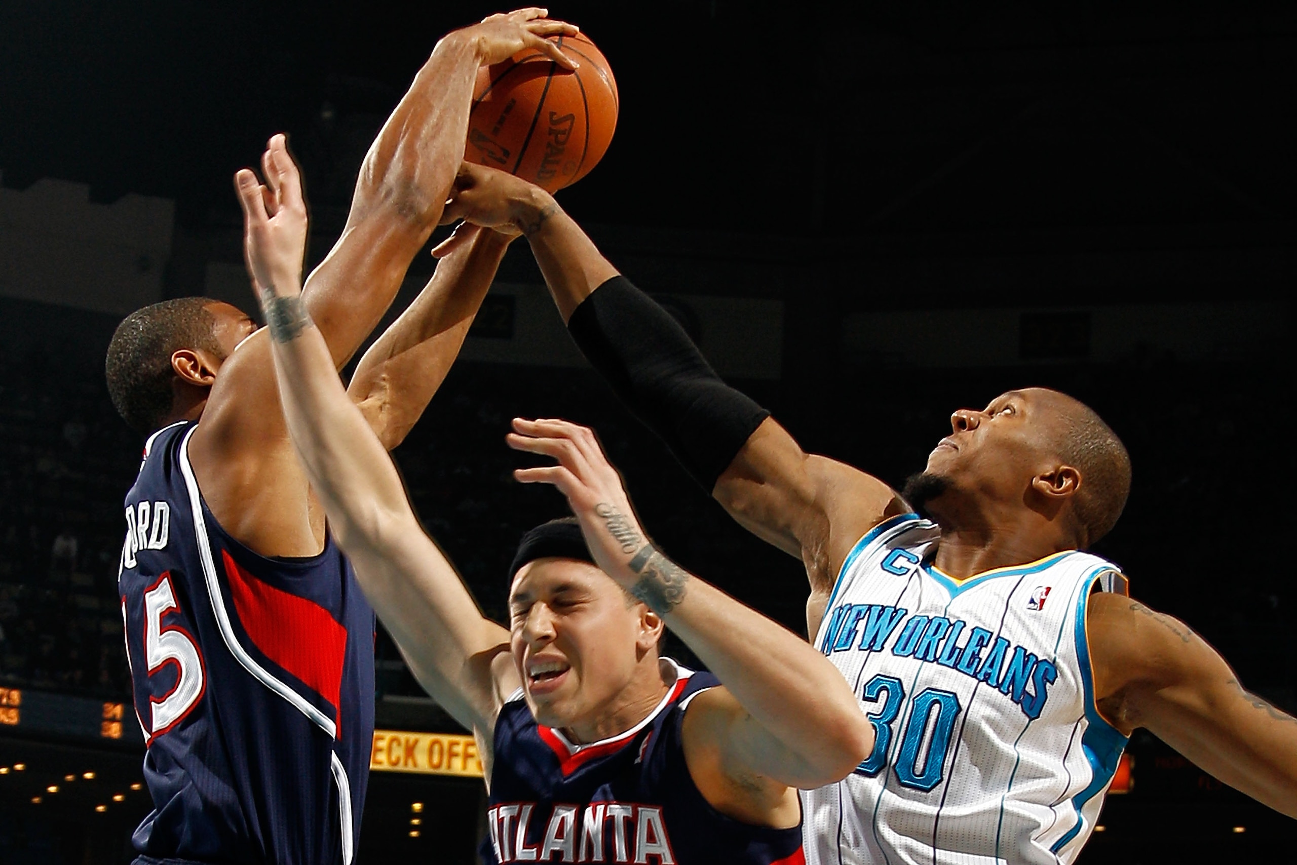 NEW ORLEANS, LA - DECEMBER 26: Al Horford #15 of the Atlanta Hawks fights for a rebound with David West #30 of the New Orleans Hornets at the New Orleans Arena on December 26, 2010 in New Orleans, Louisiana. The Hornets defeated the Hawks 93-86. NOTE T NEW ORLEANS, LA - DECEMBER 26: Al Horford #15 of the Atlanta Hawks fights for a rebound with David West #30 of the New Orleans Hornets at the New Orleans Arena on December 26, 2010 in New Orleans, Louisiana. The Hornets defeated the Hawks 93-86. NOTE T