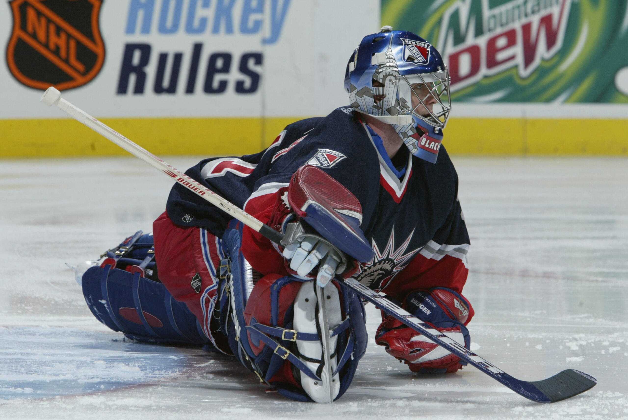 ST. LOUIS - FEBRUARY 6:  Dan Blackburn #31 of the New York Rangers stretches on the ice before the game against the St. Louis Blues on February 6, 2003 at the Savvis Center in St. Louis, Missouri.  The Blues and the Rangers tied 4-4.  (Photo by Elsa/Getty