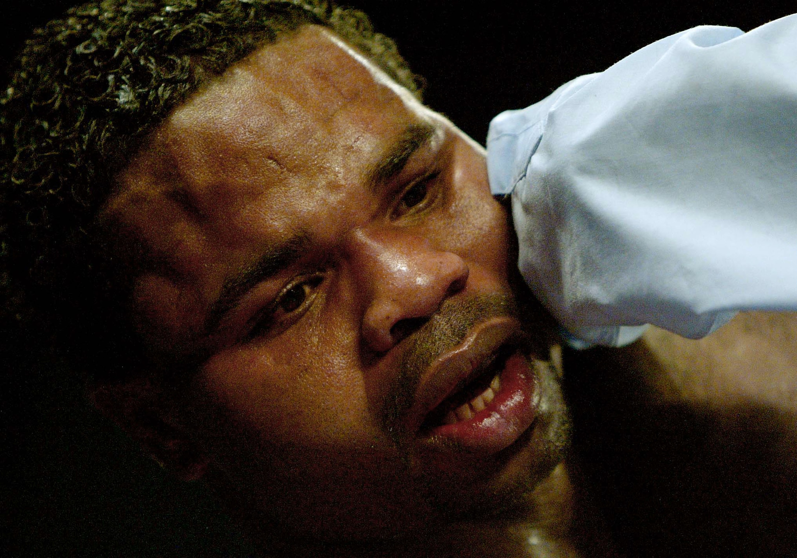 ATLANTIC CITY, NJ - DECEMBER 13:  William Joppy is looked at by the referee during the Undisputed Middleweight Championship bout against Bernard Hopkins at the Boardwalk Hall on December 13, 2003 in Atlantic City, New Jersey. Hopkins wins and remains the