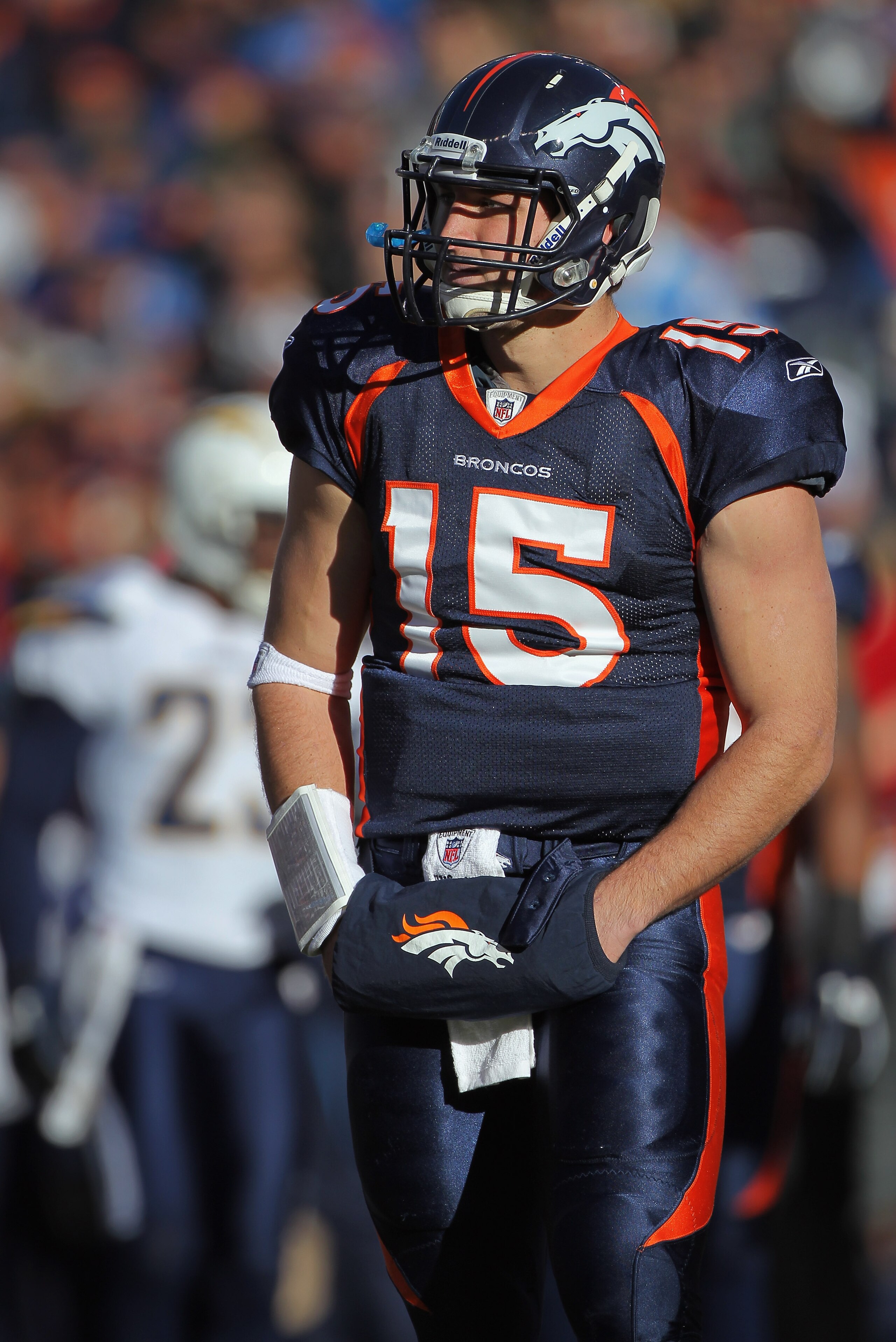 DENVER - JANUARY 02:  Quarterback Tim Tebow #15 of the Denver Broncos looks on against the San Diego Chargers at INVESCO Field at Mile High on January 2, 2011 in Denver, Colorado.  (Photo by Doug Pensinger/Getty Images)