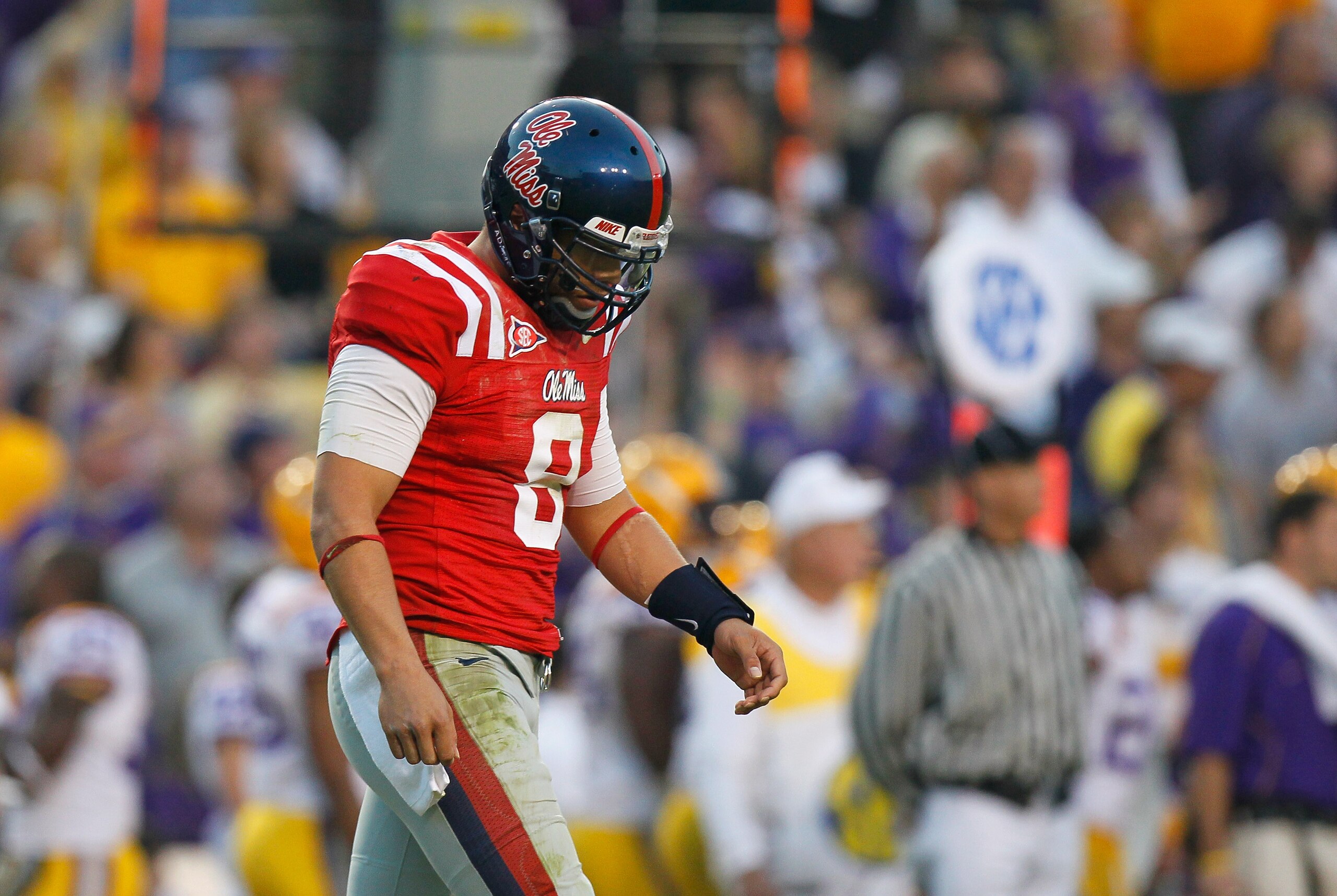 BATON ROUGE, LA - NOVEMBER 20:  Quarterback Jeremiah Masoli #8 of the Ole Miss Rebels walks off the field after a failed third down attempt against the Louisiana State University Tigers at Tiger Stadium on November 20, 2010 in Baton Rouge, Louisiana.  (Ph