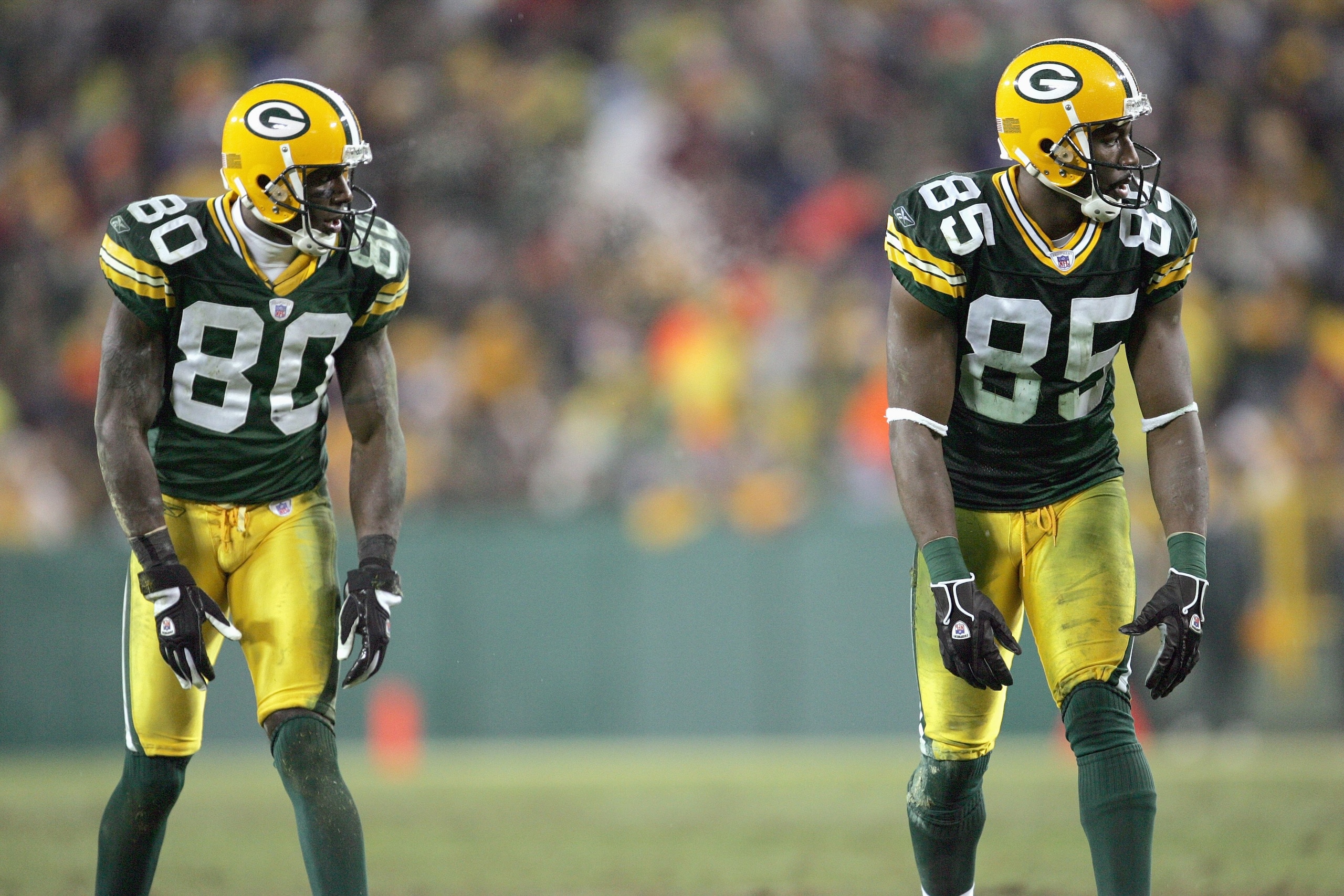 GREEN BAY, WI - DECEMBER 21: Donald Driver #80 and Greg Jennings #85 of the Green Bay Packers gets ready to move at the snap during the game against the Minnesota Vikings on December 21, 2006 at Lambeau Field in Green Bay, Wisconsin. The Packers defeated