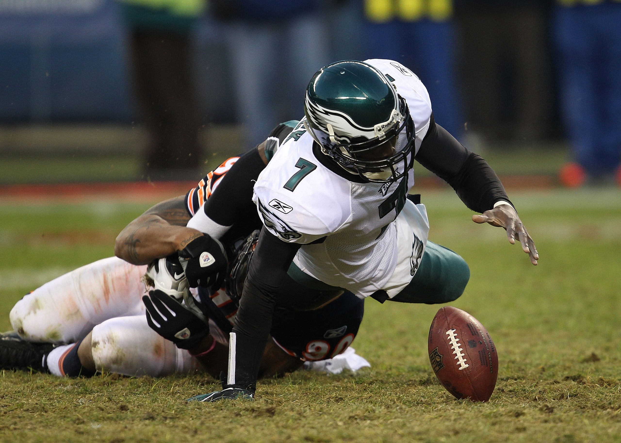 CHICAGO - NOVEMBER 28: Michael Vick #7 of the Philadelphia Eagles fumbles the ball as he is sacked by Julius Peppers #90 of the Chicago Bears at Soldier Field on November 28, 2010 in Chicago, Illinois. The Bears defeated the Eagles 31-26. (Photo by Jonath