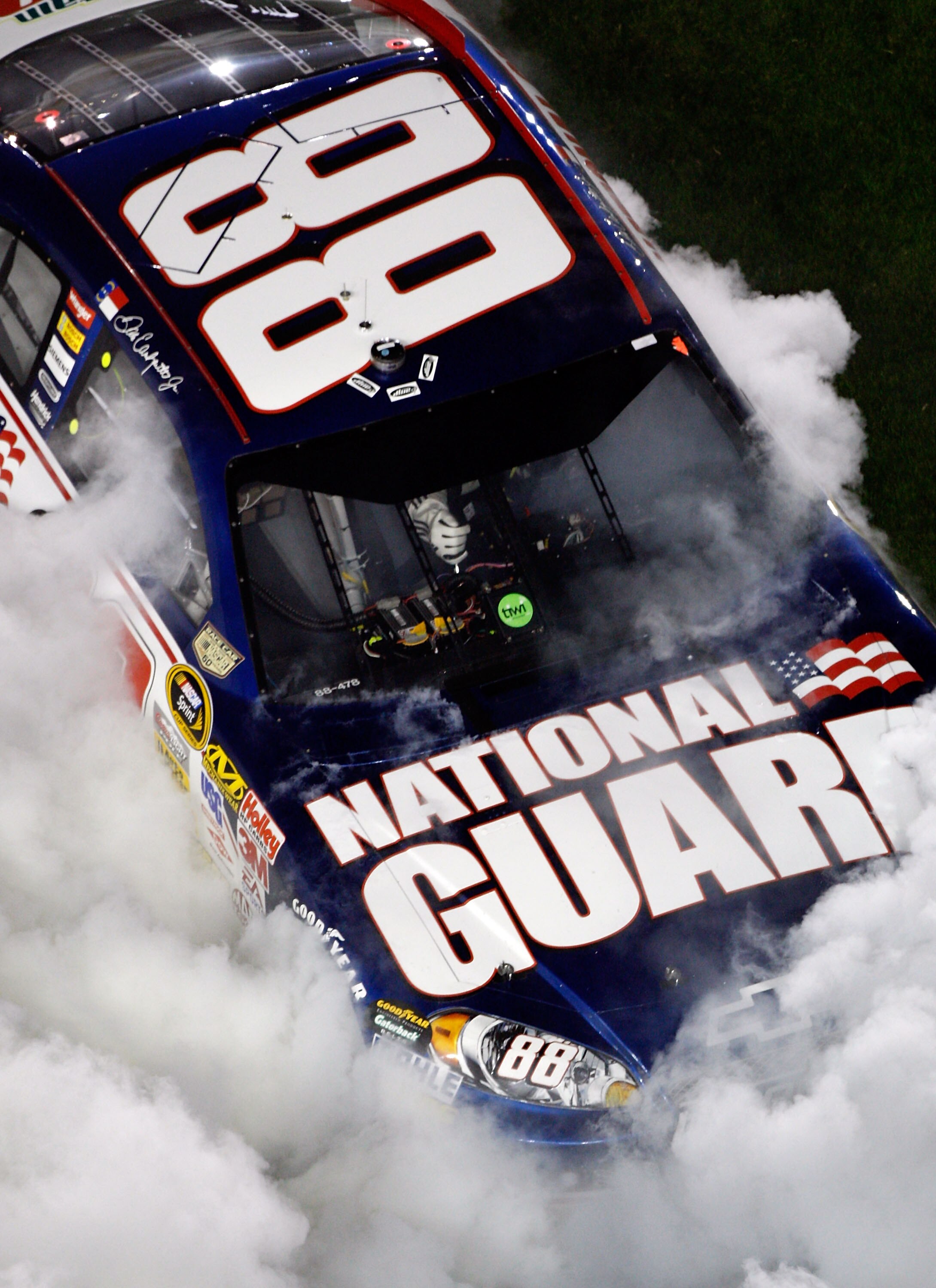 DAYTONA BEACH, FL - FEBRUARY 09:  Dale Earnhardt Jr., driver of the #88 Mountian Dew AMP/National Guard Chevrolet, does a burnout after winning the Budweiser Shootout at Daytona International Speedway on February 9, 2008 in Daytona, Florida.  (Photo by Ch