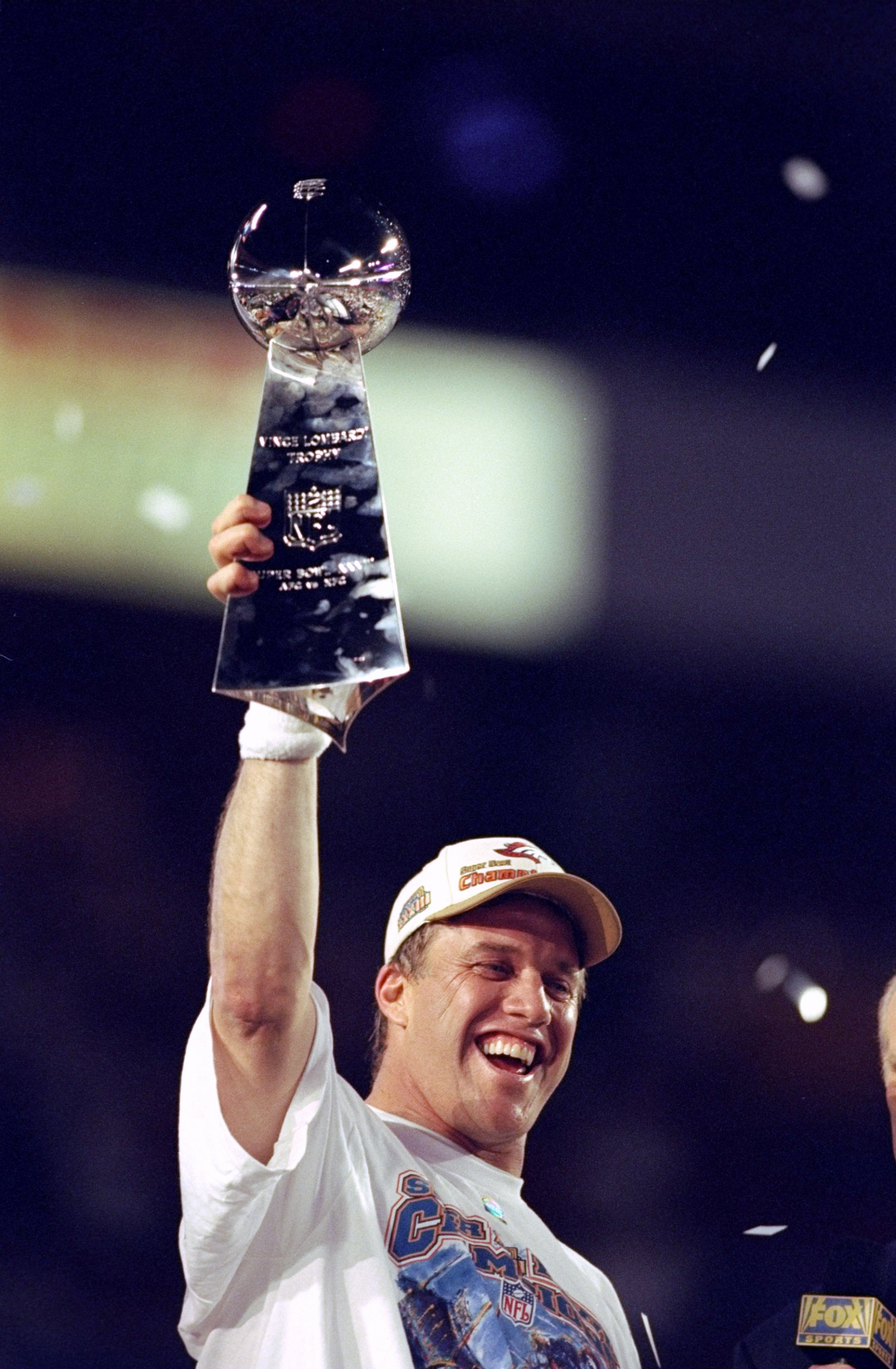 31 Jan 1999: Quarterback John Elway #7 of the Denver Broncos holds up the Vince Lombardi trophy after defeating the Atanta Falcons to win Super Bowl XXXIII at Pro Player Stadium in Miami, Florida. The Broncos defeated the Falcons 34-19 to win their second