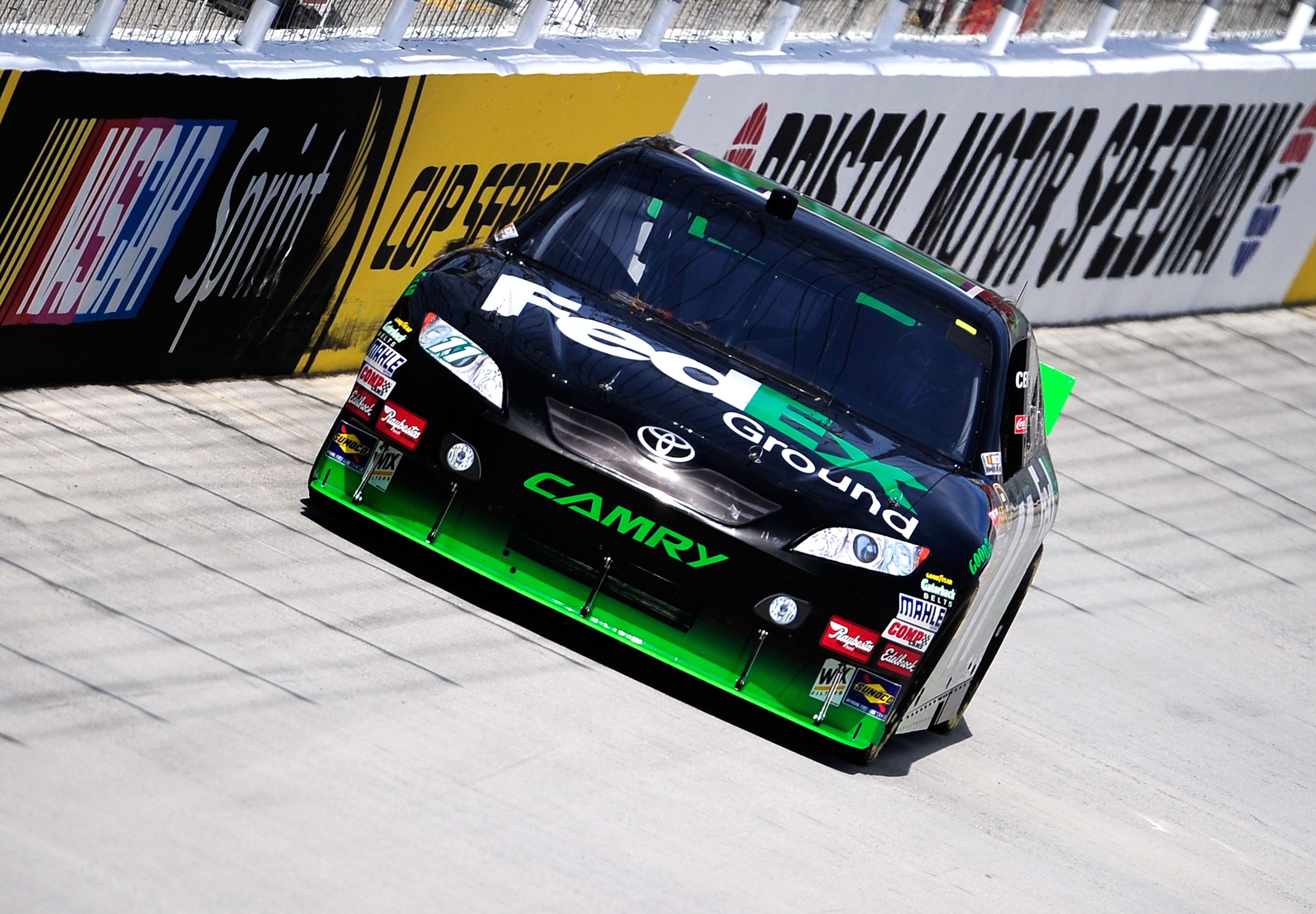 BRISTOL, TN - AUGUST 20: Denny Hamlin drives the #11 FedEx Ground Toyota during practice for the NASCAR Sprint Cup Series IRWIN Tools Night Race at Bristol Motor Speedway on August 20, 2010 in Bristol, Tennessee. (Photo by Rusty Jarrett/Getty Images for BRISTOL, TN - AUGUST 20: Denny Hamlin drives the #11 FedEx Ground Toyota during practice for the NASCAR Sprint Cup Series IRWIN Tools Night Race at Bristol Motor Speedway on August 20, 2010 in Bristol, Tennessee. (Photo by Rusty Jarrett/Getty Images for