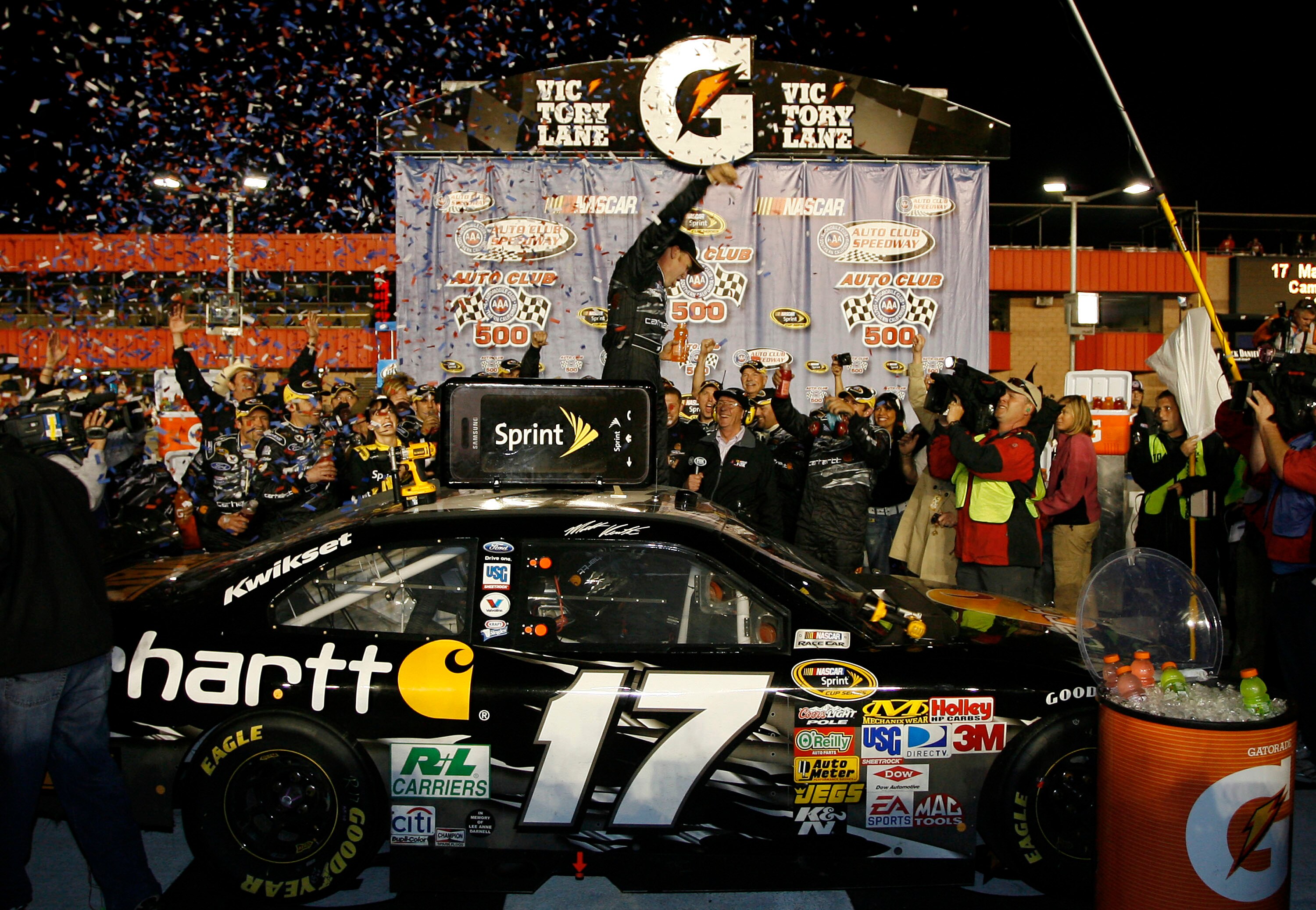 FONTANA, CA - FEBRUARY 22: Matt Kenseth, driver of the #17 Carhartt Ford, celebrates in victory lane after winning the NASCAR Sprint Cup Series Auto Club 500 at Auto Club Speedway on February 22, 2009 in Fontana, California.  (Photo by Geoff Burke/Getty I