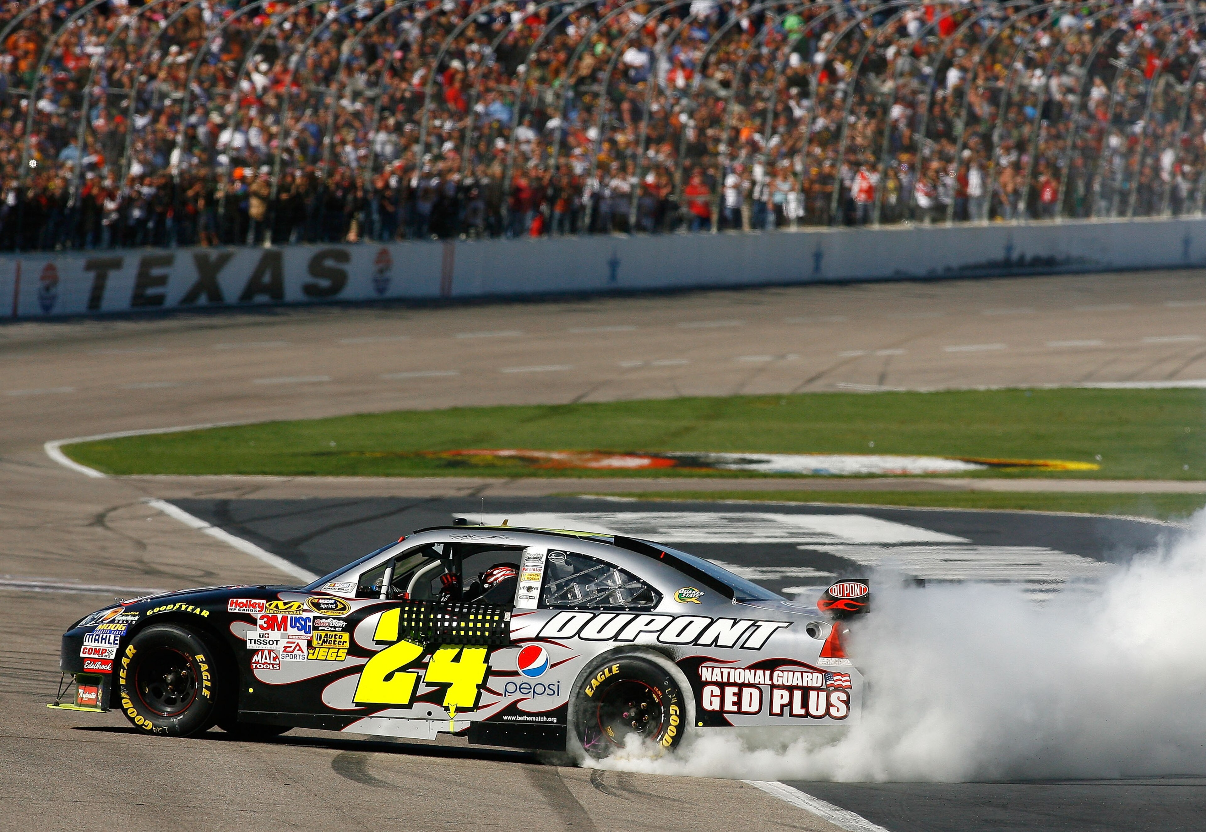 FORT WORTH, TX - APRIL 05: Jeff Gordon, driver of the #24 DuPont Chevrolet, does a victory burnout after winning the NASCAR Sprint Cup Series Samsung 500 at Texas Motor Speedway on April 5, 2009 in Fort Worth, Texas. (Photo by Jason Smith/Getty Images f FORT WORTH, TX - APRIL 05: Jeff Gordon, driver of the #24 DuPont Chevrolet, does a victory burnout after winning the NASCAR Sprint Cup Series Samsung 500 at Texas Motor Speedway on April 5, 2009 in Fort Worth, Texas. (Photo by Jason Smith/Getty Images f