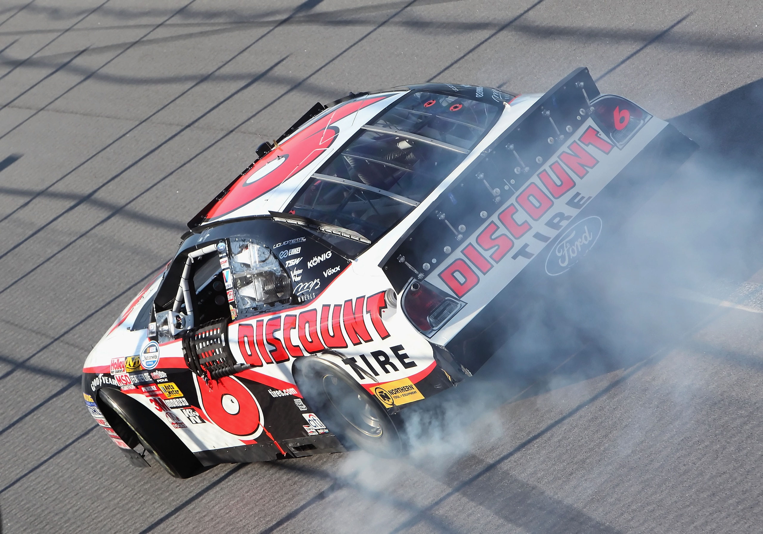 TALLADEGA, AL - APRIL 25:  David Ragan, driver of the #6 Discount Tire Ford, performs a burn out after winning the NASCAR Nationwide Series Aaron's 312 at Talladega Superspeedway on April 25, 2009 in Talladega, Alabama.  (Photo by Christian Petersen/Getty
