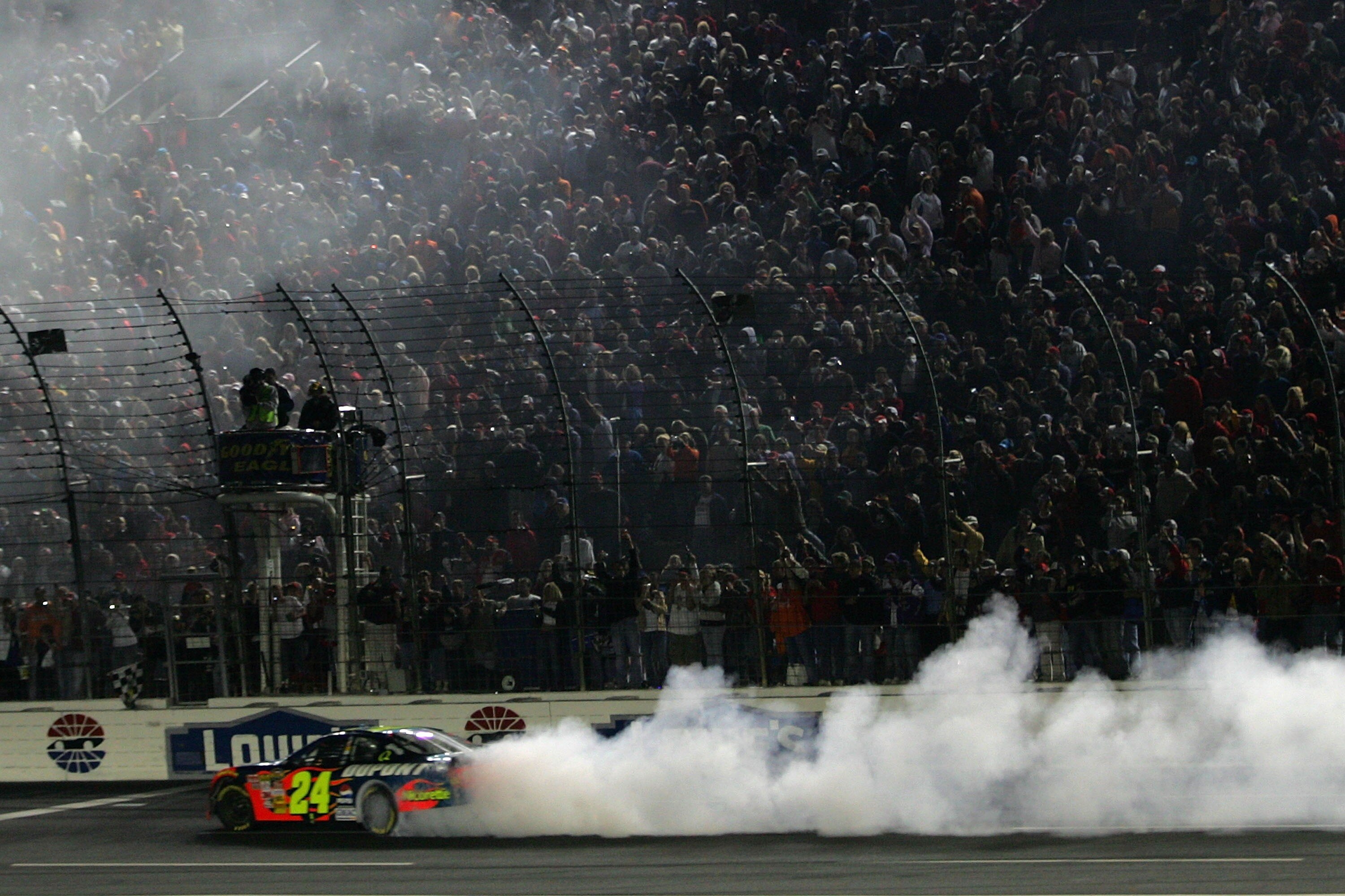 CONCORD, NC - OCTOBER 13:  Jeff Gordon, driver of the #24 DuPont Chevrolet, does a victory burnout after winning the NASCAR Nextel Cup Series Bank of America 500 at Lowe's Motor Speedway on October 13, 2007 in Concord, North Carolina.  (Photo by Todd Wars