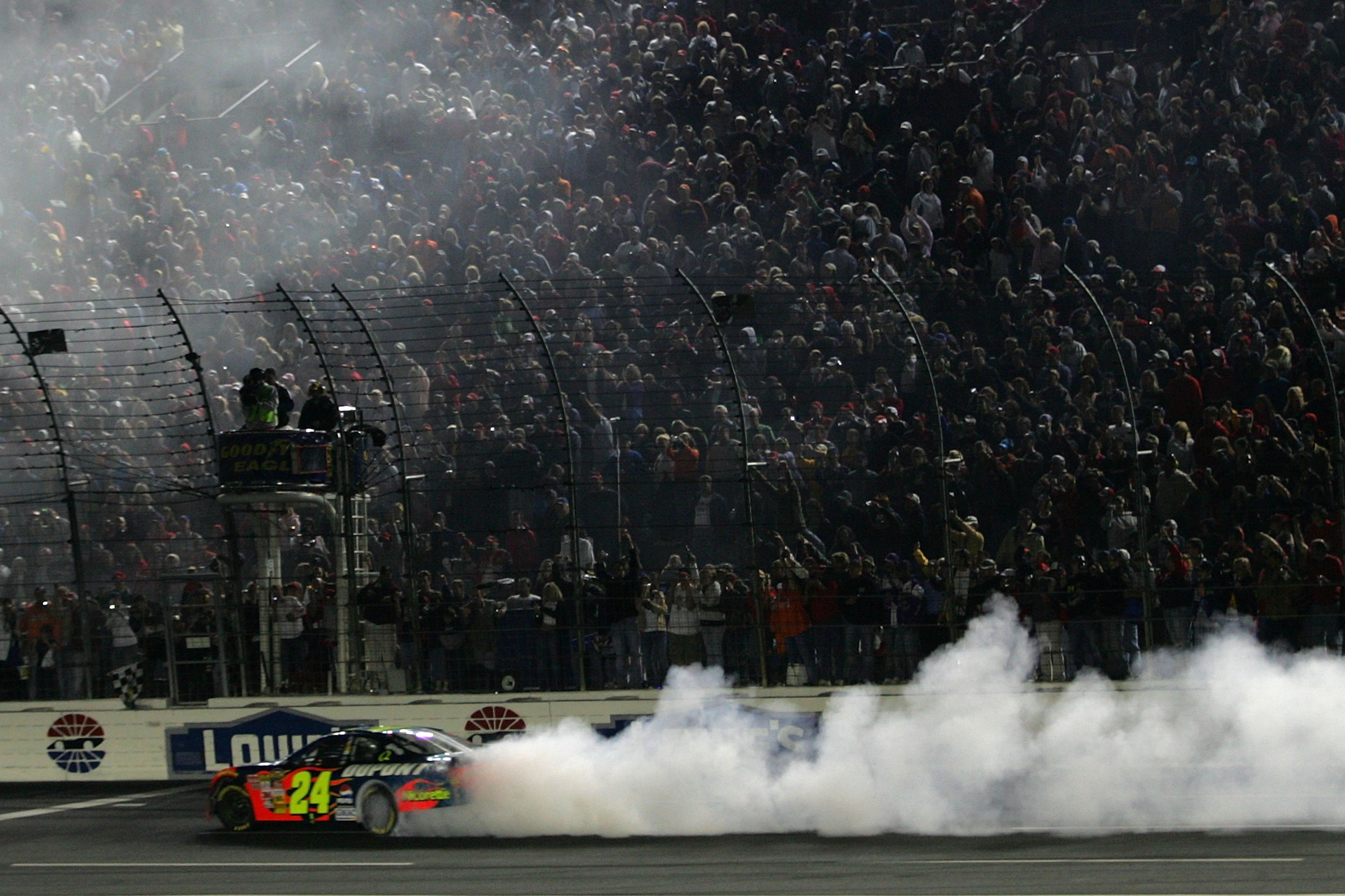 CONCORD, NC - OCTOBER 13: Jeff Gordon, driver of the #24 DuPont Chevrolet, does a victory burnout after winning the NASCAR Nextel Cup Series Bank of America 500 at Lowe's Motor Speedway on October 13, 2007 in Concord, North Carolina. (Photo by Todd Wars CONCORD, NC - OCTOBER 13: Jeff Gordon, driver of the #24 DuPont Chevrolet, does a victory burnout after winning the NASCAR Nextel Cup Series Bank of America 500 at Lowe's Motor Speedway on October 13, 2007 in Concord, North Carolina. (Photo by Todd Wars