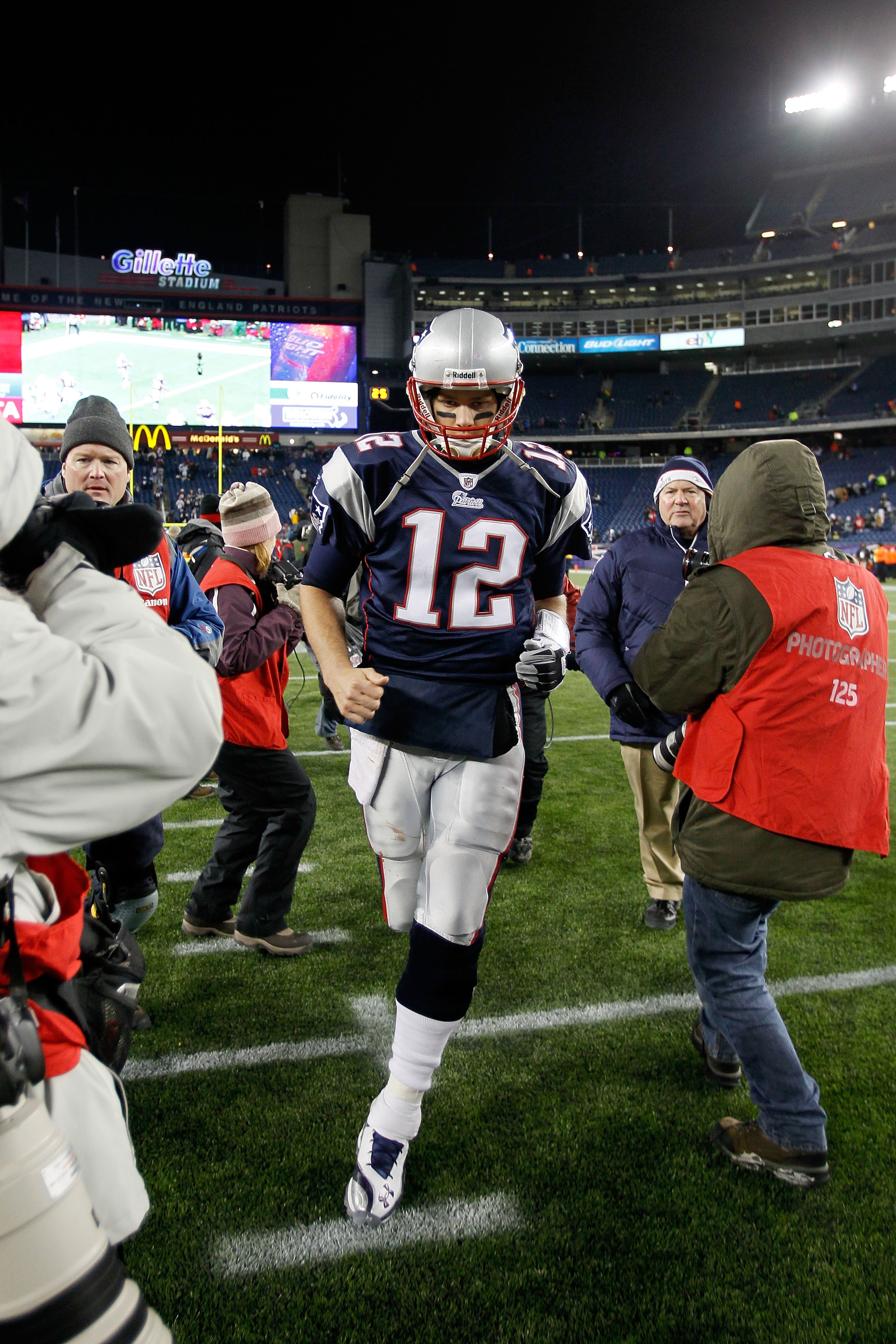 FOXBORO, MA - DECEMBER 06:  Tom Brady #12 of the New England Patriots runs off the field after the Patriots won 45-3 against the New York Jets at Gillette Stadium on December 6, 2010 in Foxboro, Massachusetts.  (Photo by Jim Rogash/Getty Images)