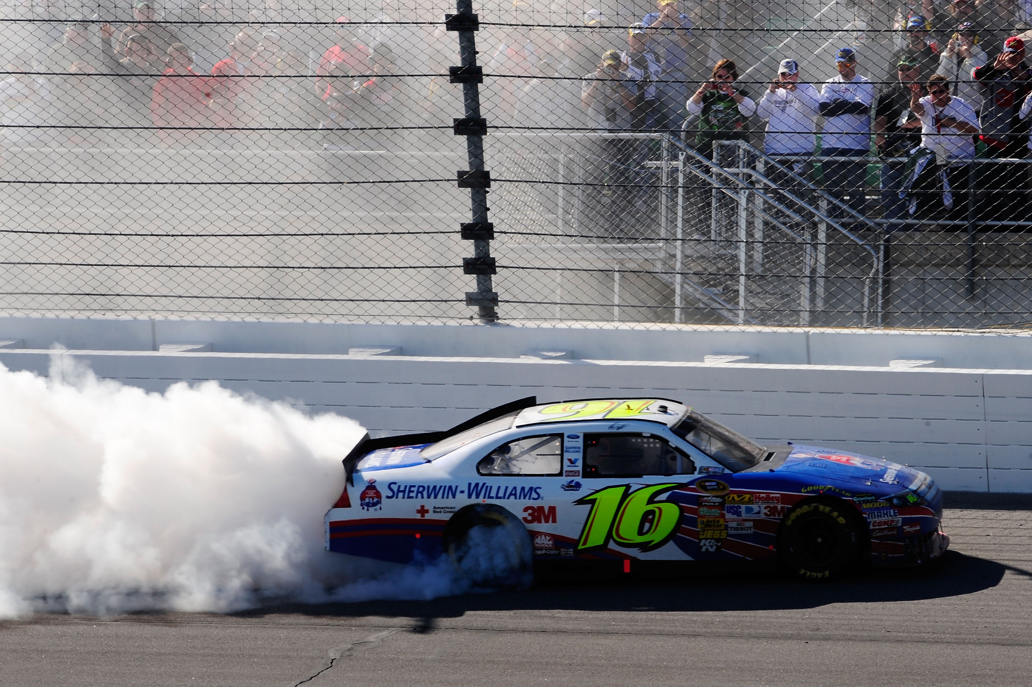 KANSAS CITY, KS - OCTOBER 03:  Greg Biffle, driver of the #16 3M Ford, celebrates with a burnout after winning the NASCAR Sprint Cup Series Price Chopper 400 on October 3, 2010 in Kansas City, Kansas.  (Photo by Rusty Jarrett/Getty Images)