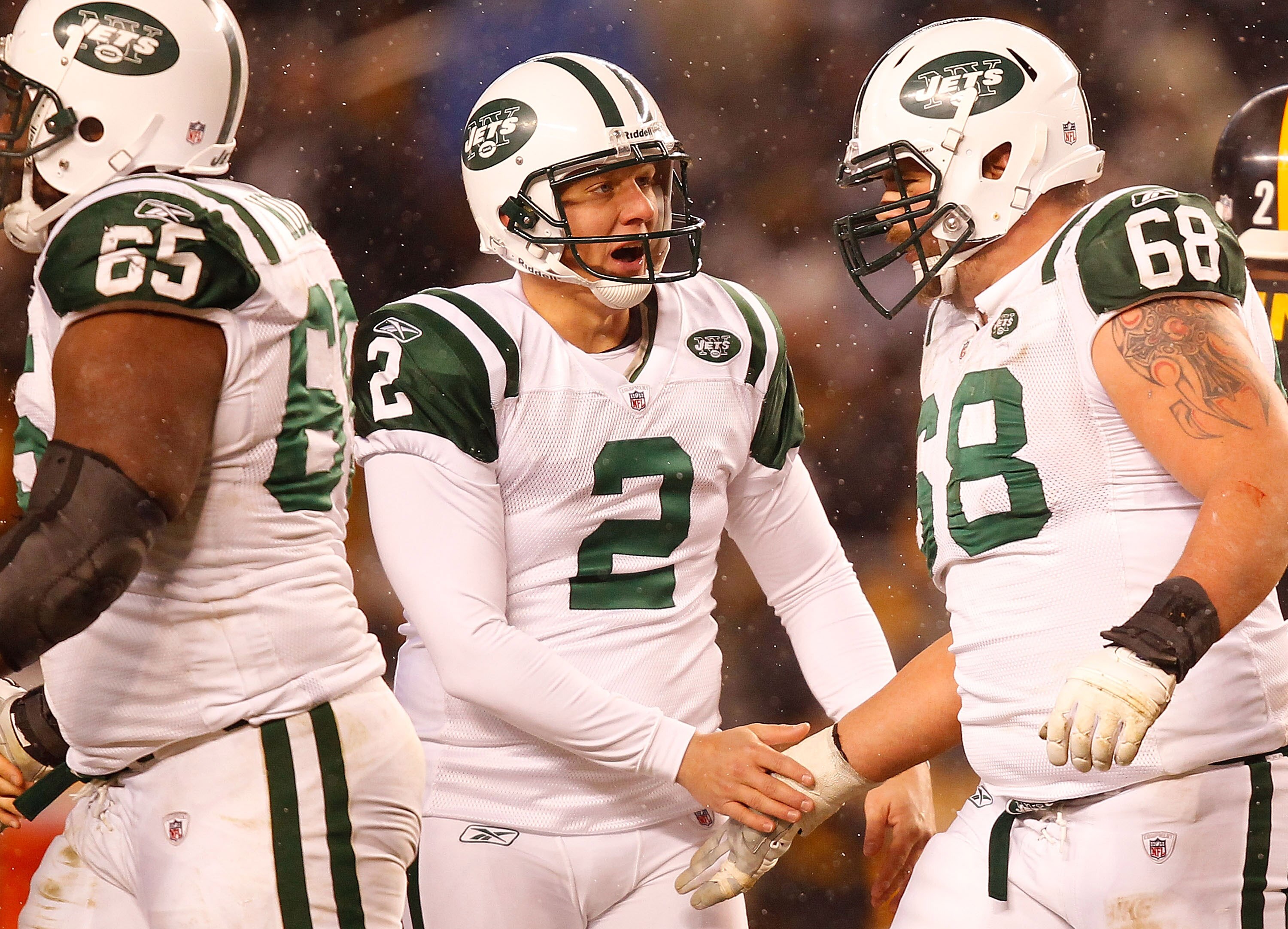 PITTSBURGH - DECEMBER 19:  Nick Folk #2 of the New York Jets celebrates with teammate Matt Slauson #68 after kicking a field goal during the game against the Pittsburgh Steelers on December 19, 2010 at Heinz Field in Pittsburgh, Pennsylvania.  (Photo by J