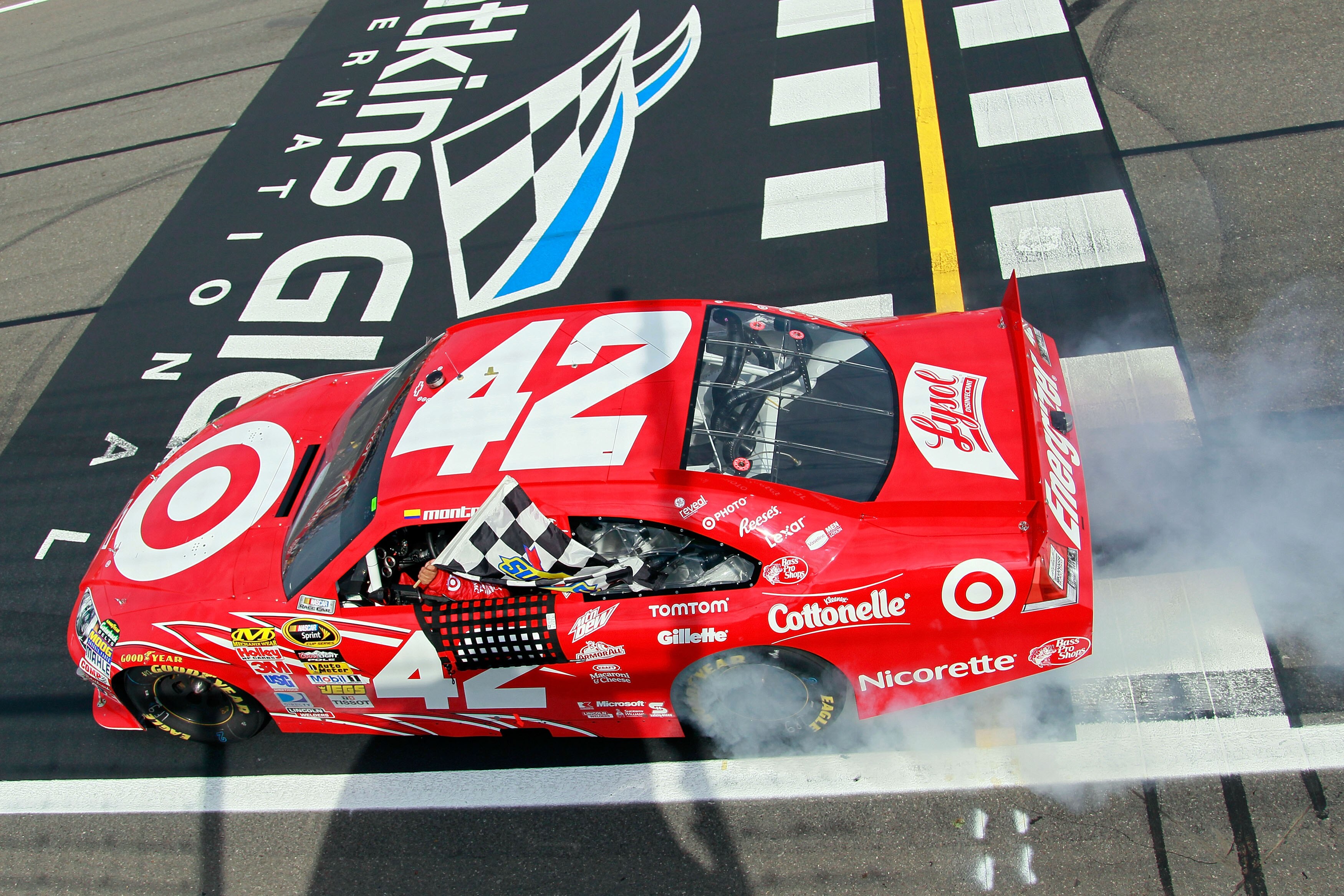 WATKINS GLEN, NY - AUGUST 08:  Juan Pablo Montoya, driver of the #42 Target Chevrolet, performs a burnout after winning the NASCAR Sprint Cup Series Heluva Good! Sour Cream Dips at Watkins Glen International on August 8, 2010 in Watkins Glen, New York.  (