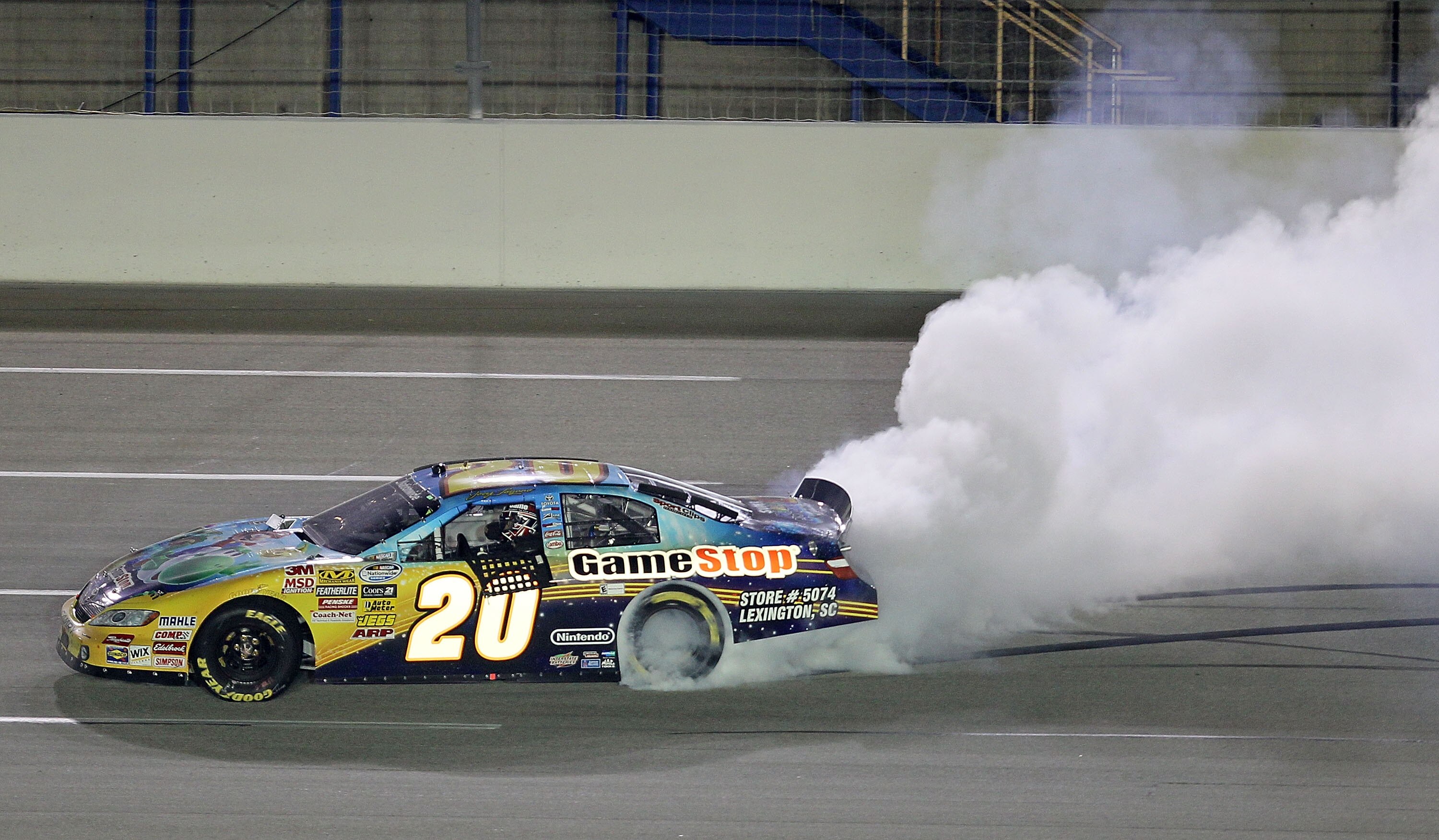 SPARTA, KY - JUNE 12:  Joey Logano, driver of the #20 GameStop Toyota, performs a burnout to celebrate after winning the NASCAR Nationwide Series Meijer 300 presented by Ritz at Kentucky Speedway on June 12, 2010 in Sparta, Kentucky.  (Photo by Andy Lyons