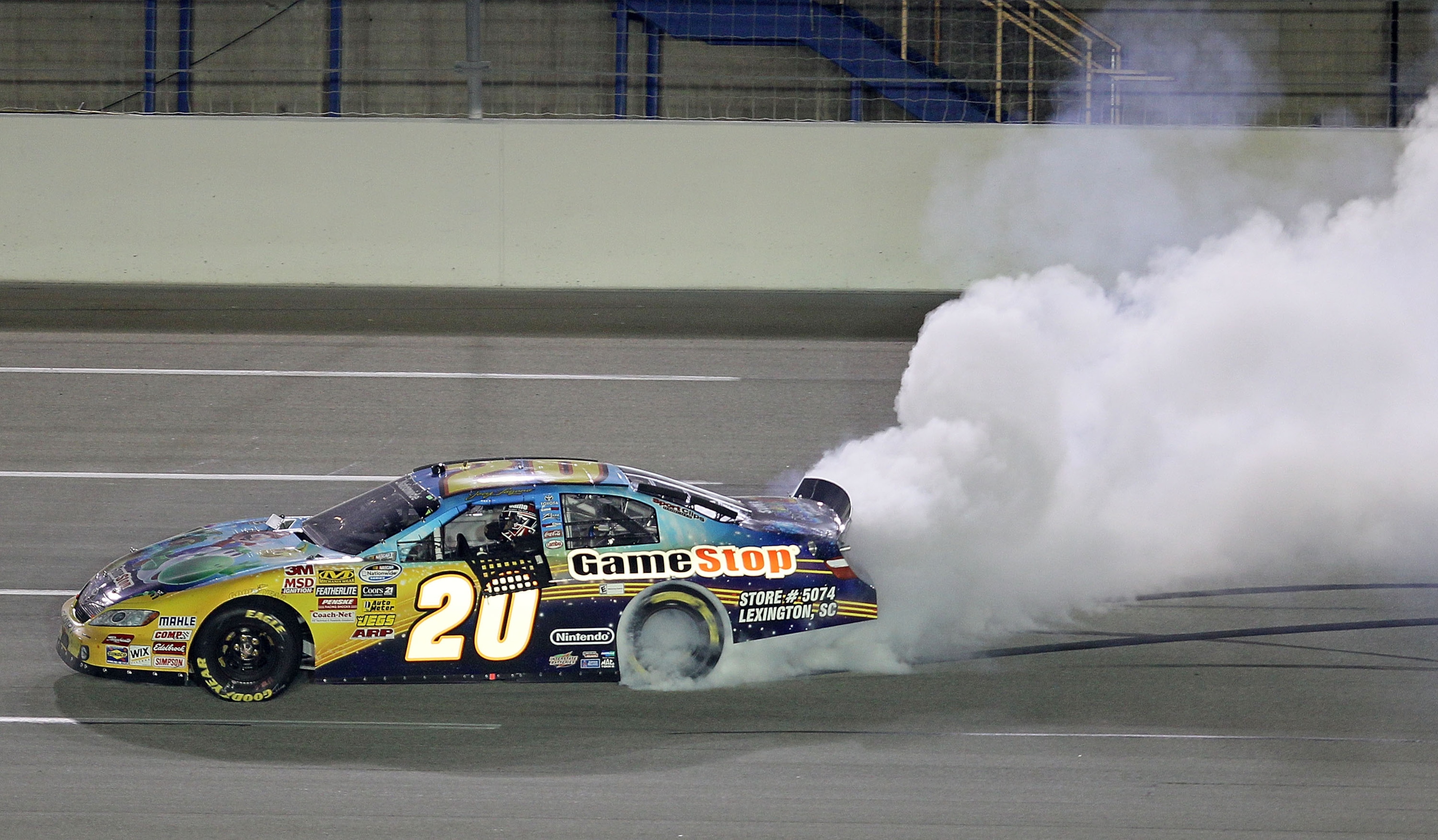 SPARTA, KY - JUNE 12: Joey Logano, driver of the #20 GameStop Toyota, performs a burnout to celebrate after winning the NASCAR Nationwide Series Meijer 300 presented by Ritz at Kentucky Speedway on June 12, 2010 in Sparta, Kentucky. (Photo by Andy Lyons SPARTA, KY - JUNE 12: Joey Logano, driver of the #20 GameStop Toyota, performs a burnout to celebrate after winning the NASCAR Nationwide Series Meijer 300 presented by Ritz at Kentucky Speedway on June 12, 2010 in Sparta, Kentucky. (Photo by Andy Lyons