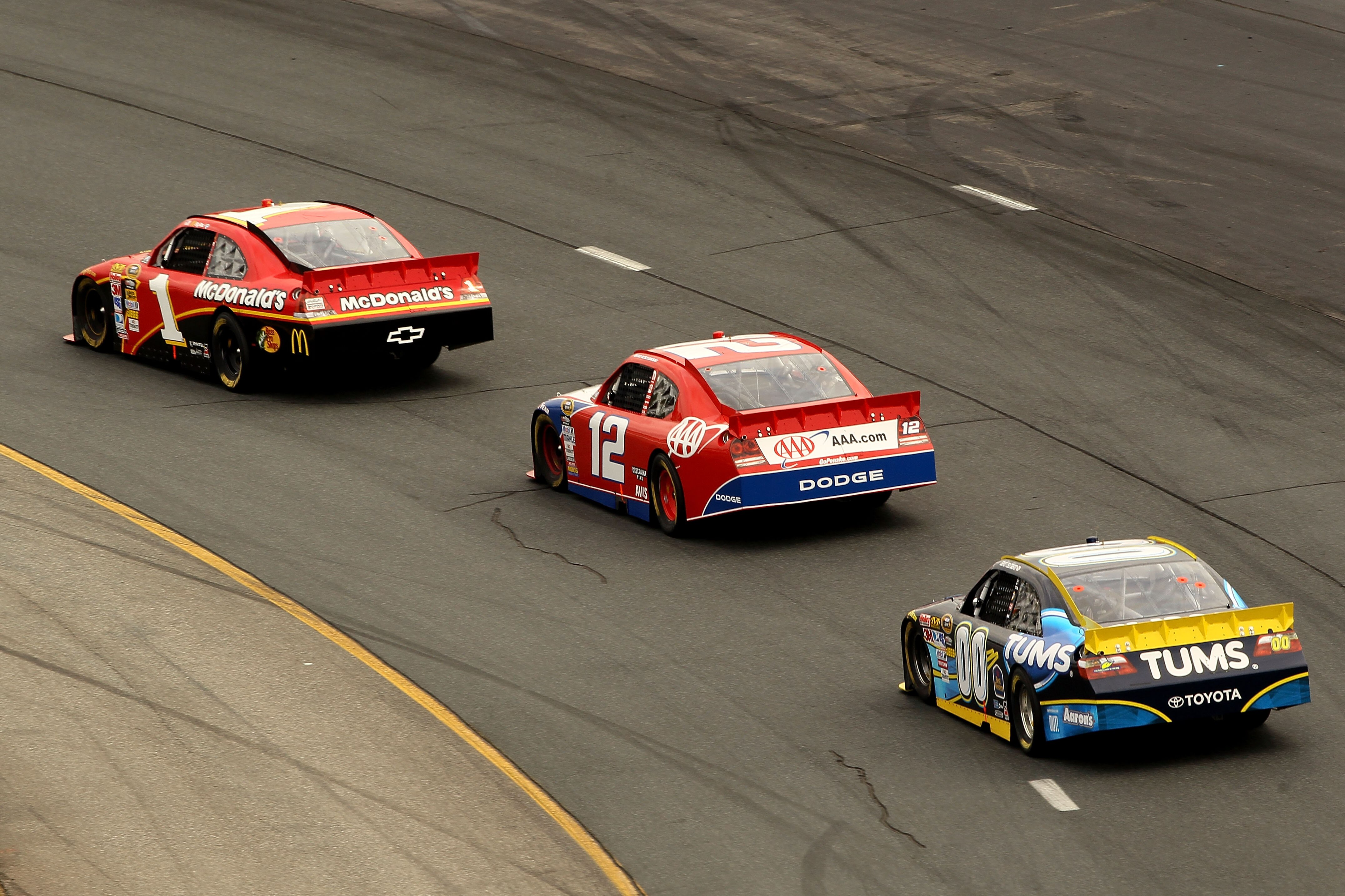 LOUDON, NH - SEPTEMBER 19:  Jamie McMurray, driver of the #1 McDonald's Chevrolet, leads Brad Keselowski, driver of the #12 No. 12 Penske / AAA Dodge and David Reutimann, driver of the #00 TUMS Toyota, during the NASCAR Sprint Cup Series Sylvania 300 at N