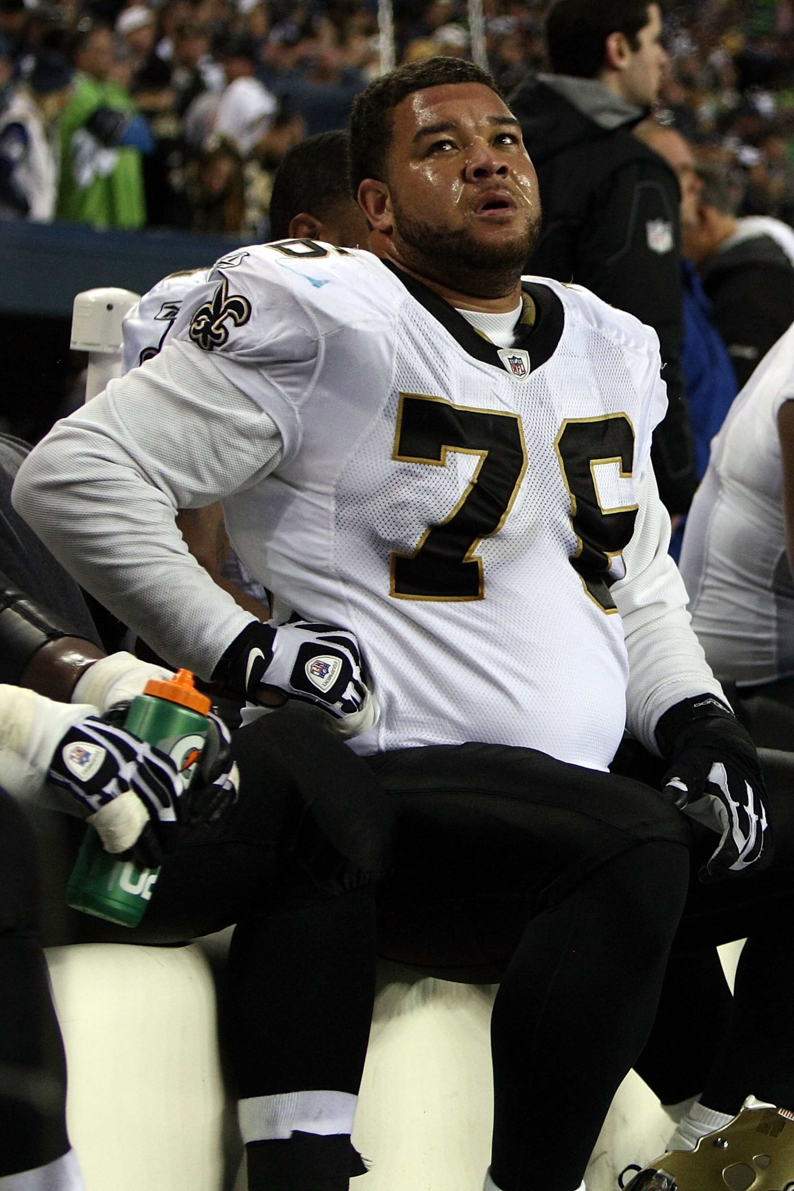 SEATTLE, WA - JANUARY 08:  Jonathan Goodwin #76 of the New Orleans Saints sits on the bench late in the fourth quarter before losing to the Seattle Seahawks 41-36 during the 2011 NFC wild-card playoff game at Qwest Field on January 8, 2011 in Seattle, Was