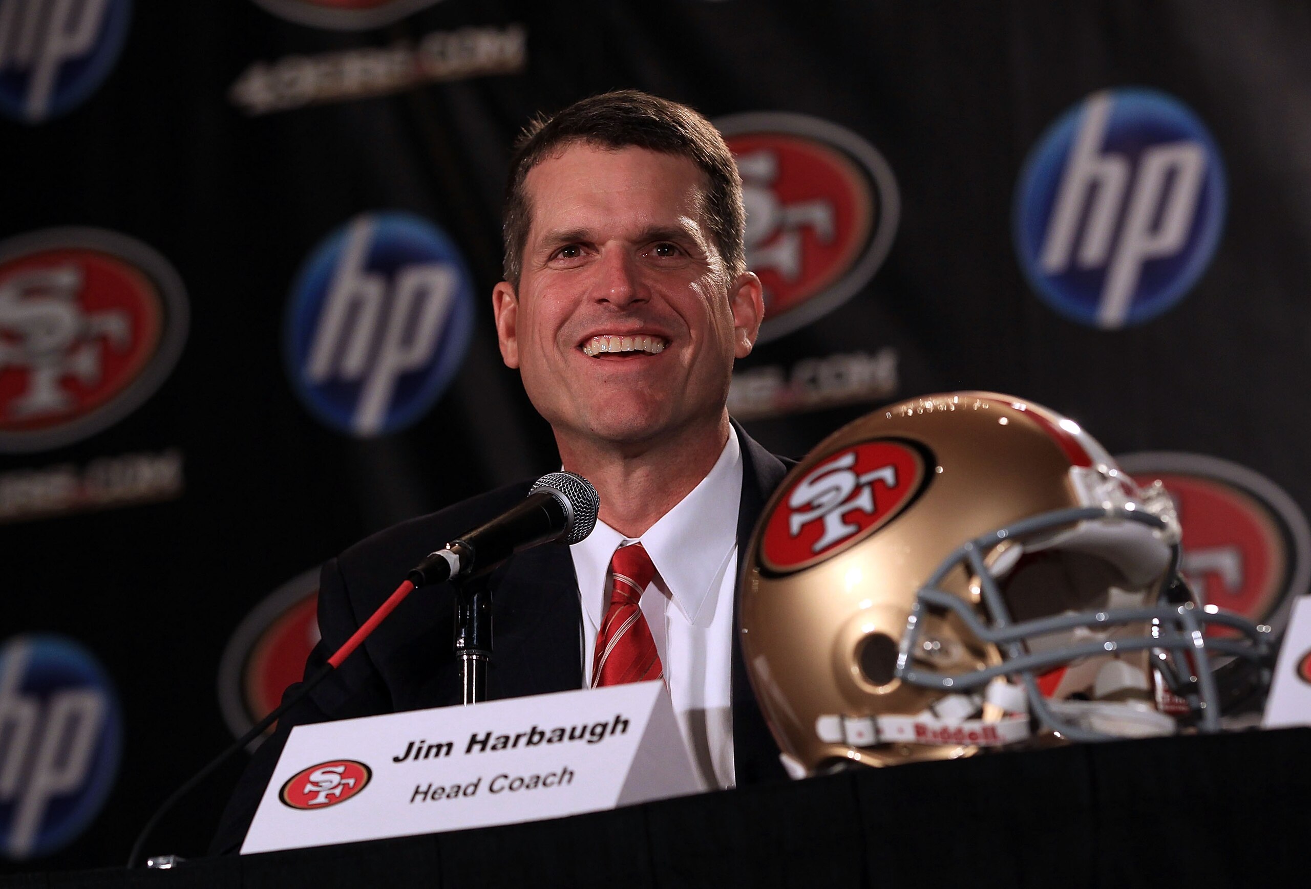 SAN FRANCISCO, CA - JANUARY 07:  Jim Harbaugh speaks at a press conference where he was introduced as the new San Francisco 49ers head coach at the Palace Hotel on January 7, 2011 in San Francisco, California.  (Photo by Ezra Shaw/Getty Images)