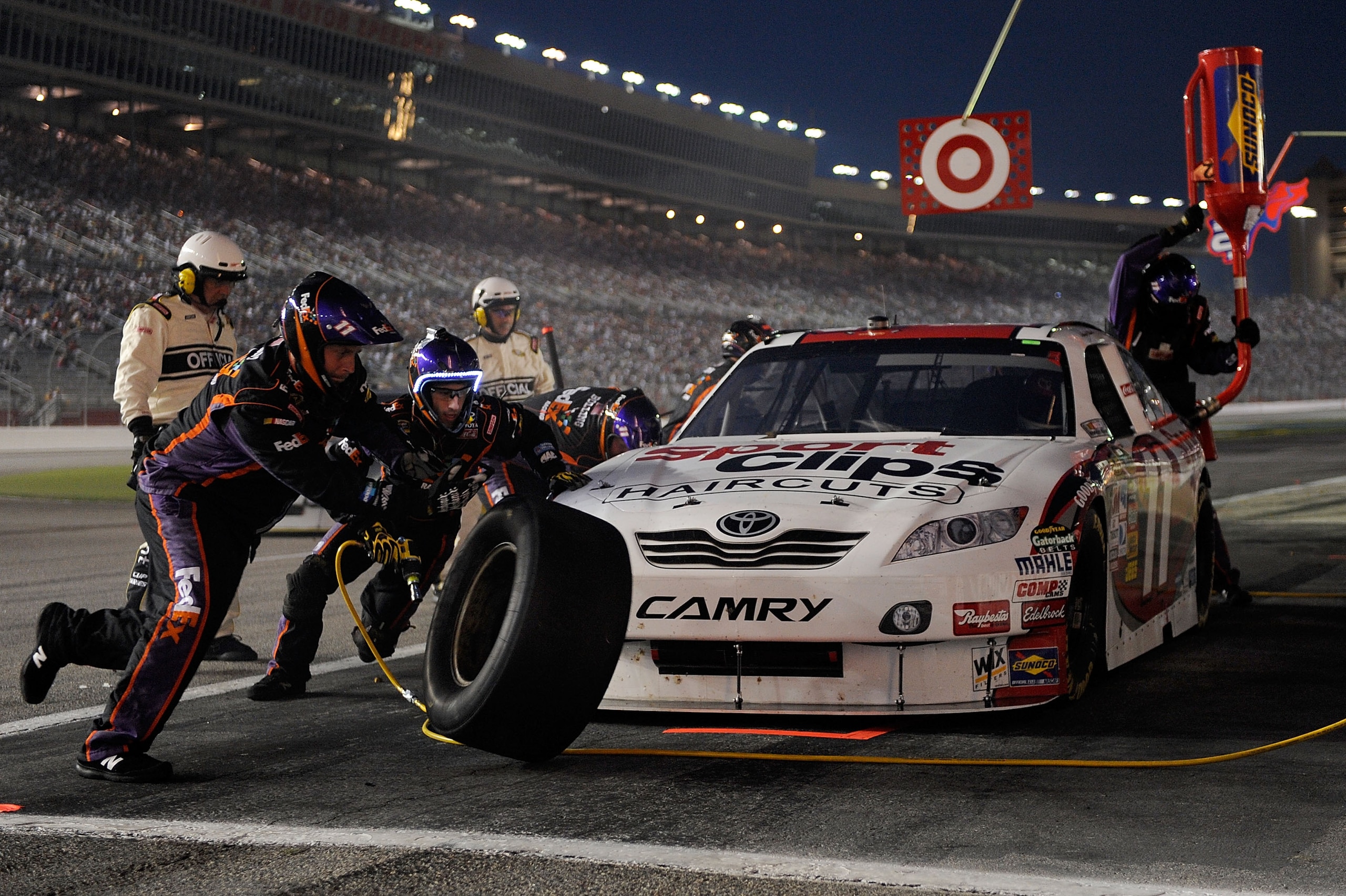 HAMPTON, GA - SEPTEMBER 05:  Denny Hamlin, driver of the #11 FedEx Office Toyota, pits during the NASCAR Sprint Cup Series Emory Healthcare 500 at Atlanta Motor Speedway on September 5, 2010 in Hampton, Georgia.  (Photo by John Harrelson/Getty Images for 