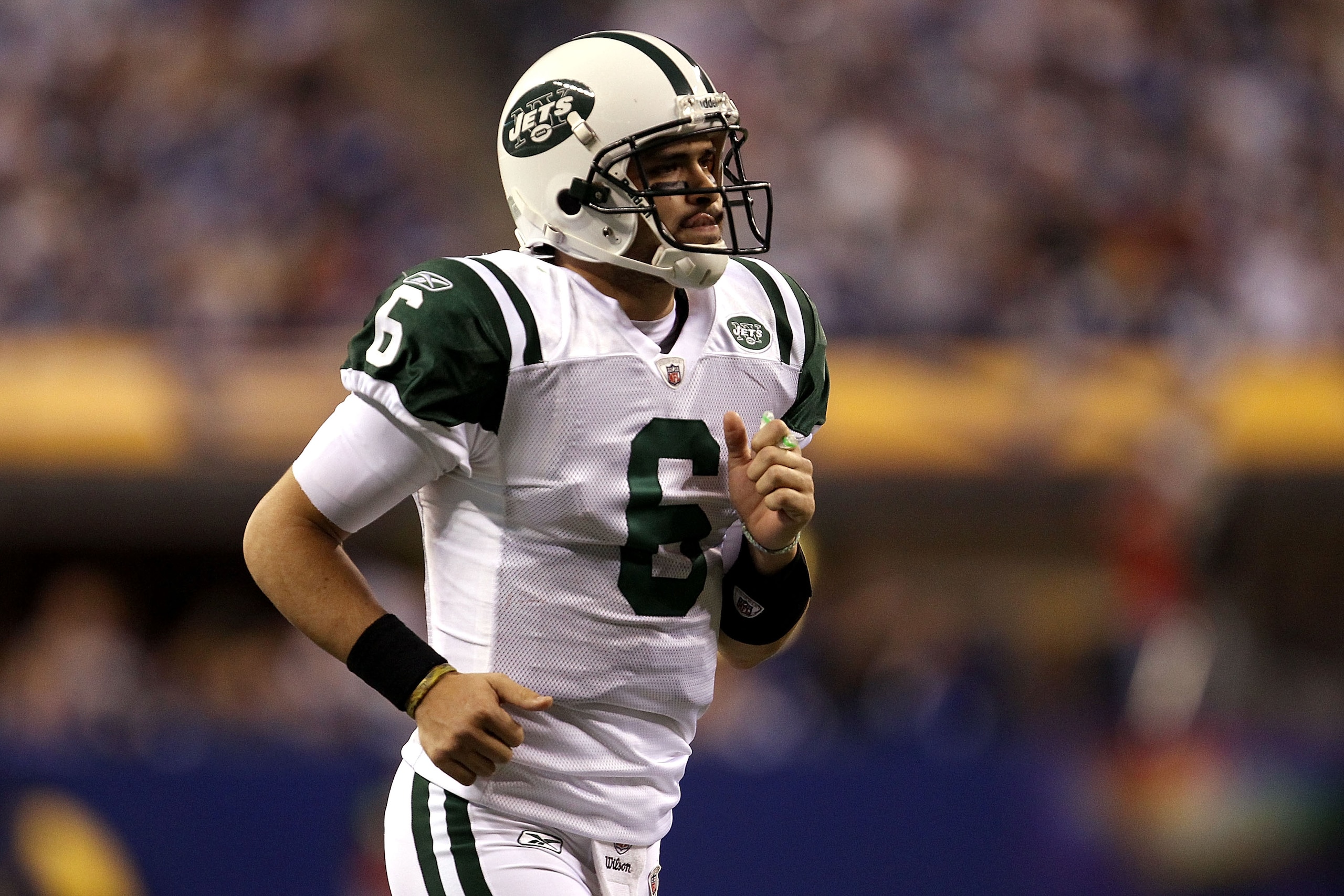 INDIANAPOLIS, IN - JANUARY 08:  Mark Sanchez #6 of the New York Jets runs on the field against the Indianapolis Colts during their 2011 AFC wild card playoff game at Lucas Oil Stadium on January 8, 2011 in Indianapolis, Indiana.  (Photo by Jonathan Daniel
